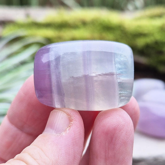 Lilac Fluorite Crystal. Lilac Fluorite also known as Lavender Fluorite is often described as a "balancing bridge" between the heart and the higher mind, offering a soothing energy that aids both emotional and spiritual harmony.