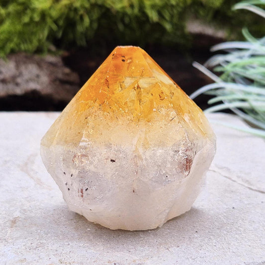 Citrine Crystal Standing Point from Brazil. Has light reflecting inclusions at the tip. Point is polished, sides are natural and the base is cut flat so it will sit on an even surface.