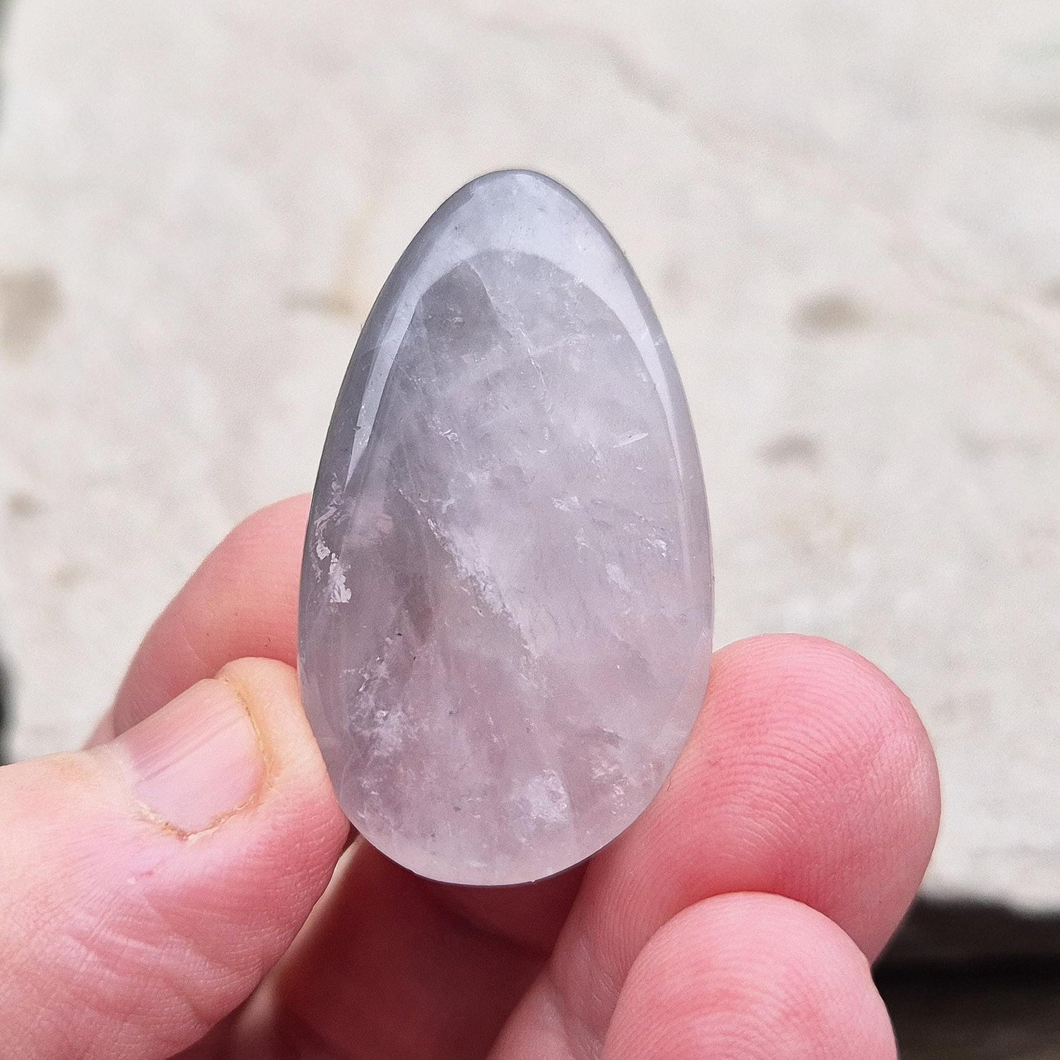 Lunar Quartz Crystal Palm Stone, also known as Lunar Rose Quartz, comes from Namibia.