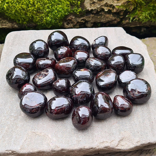 Red Garnet, Polished. from India. Nice deep red polished crystals. Also called Almandite, Almandine Garnet. 