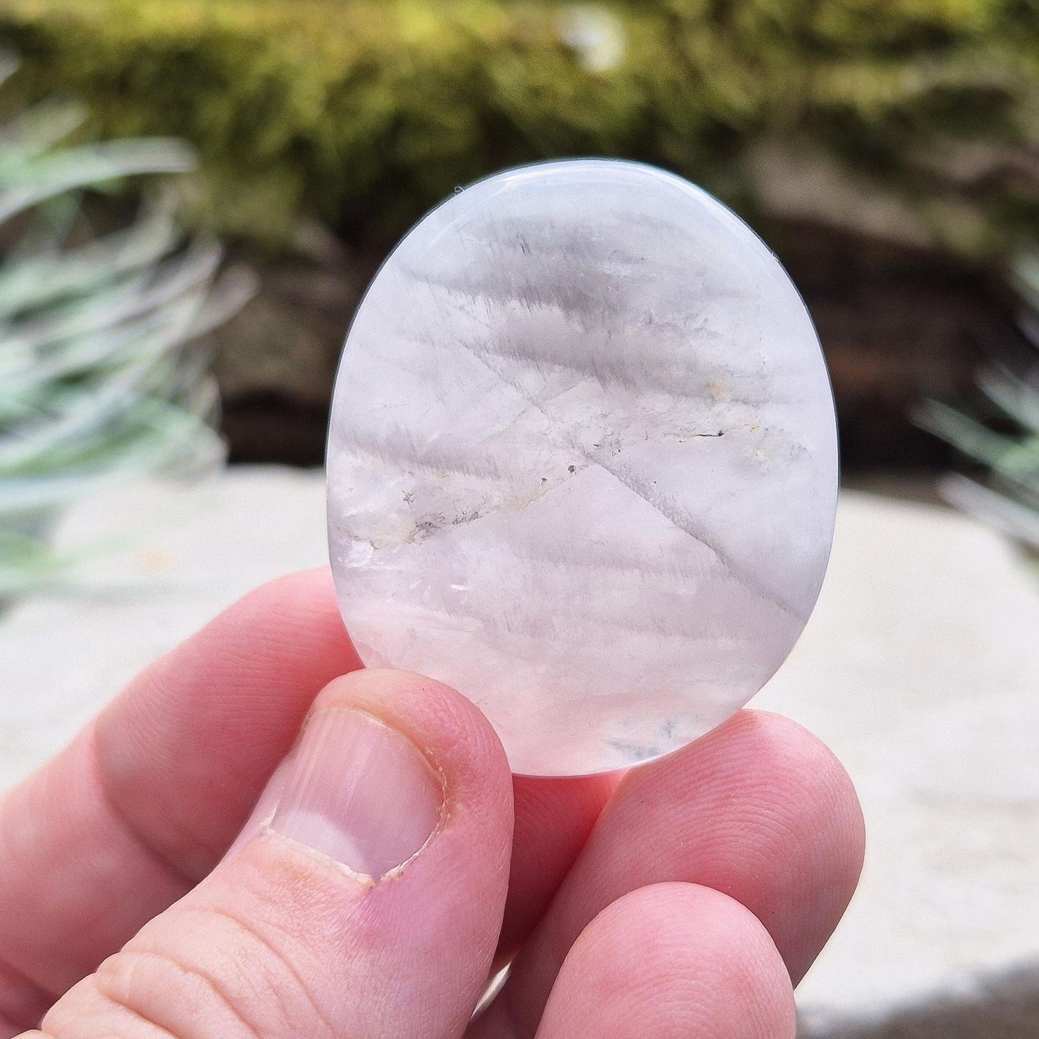 Lunar Quartz Crystal Palm Stone, also known as Lunar Rose Quartz, comes from Namibia.