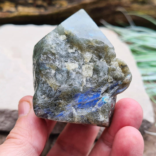 Labradorite Crystal, Standing Point, also known as Spectrolite. Tip has been polished, base has been polished and the natural sides feel like they have been smoothed out also. Piece has some blue flash which can be seen in the right light and at the right angle.