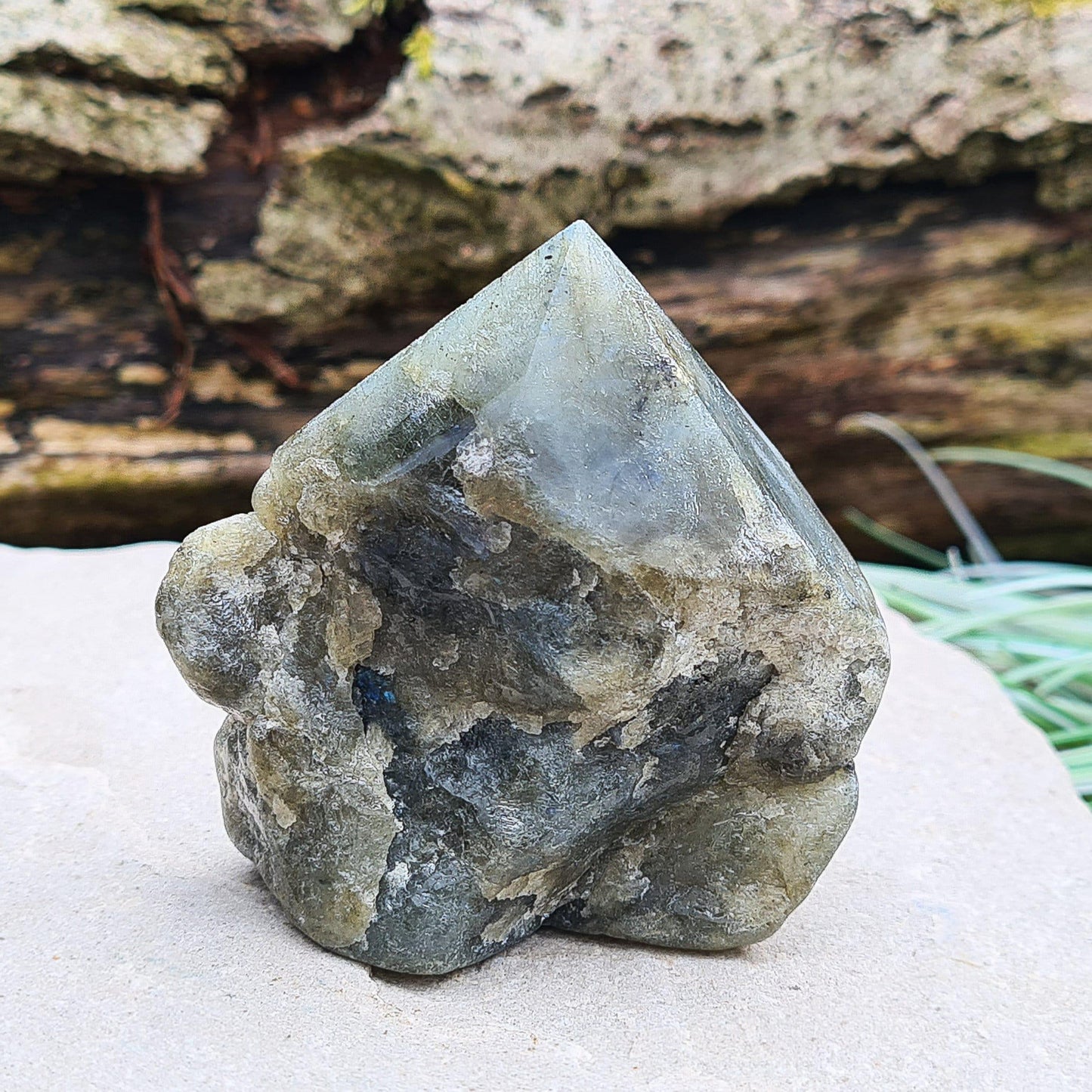 Labradorite Crystal, Standing Point, also known as Spectrolite. Tip has been polished, base has been polished and the natural sides feel like they have been smoothed out also. Piece has some blue flash which can be seen in the right light and at the right angle.