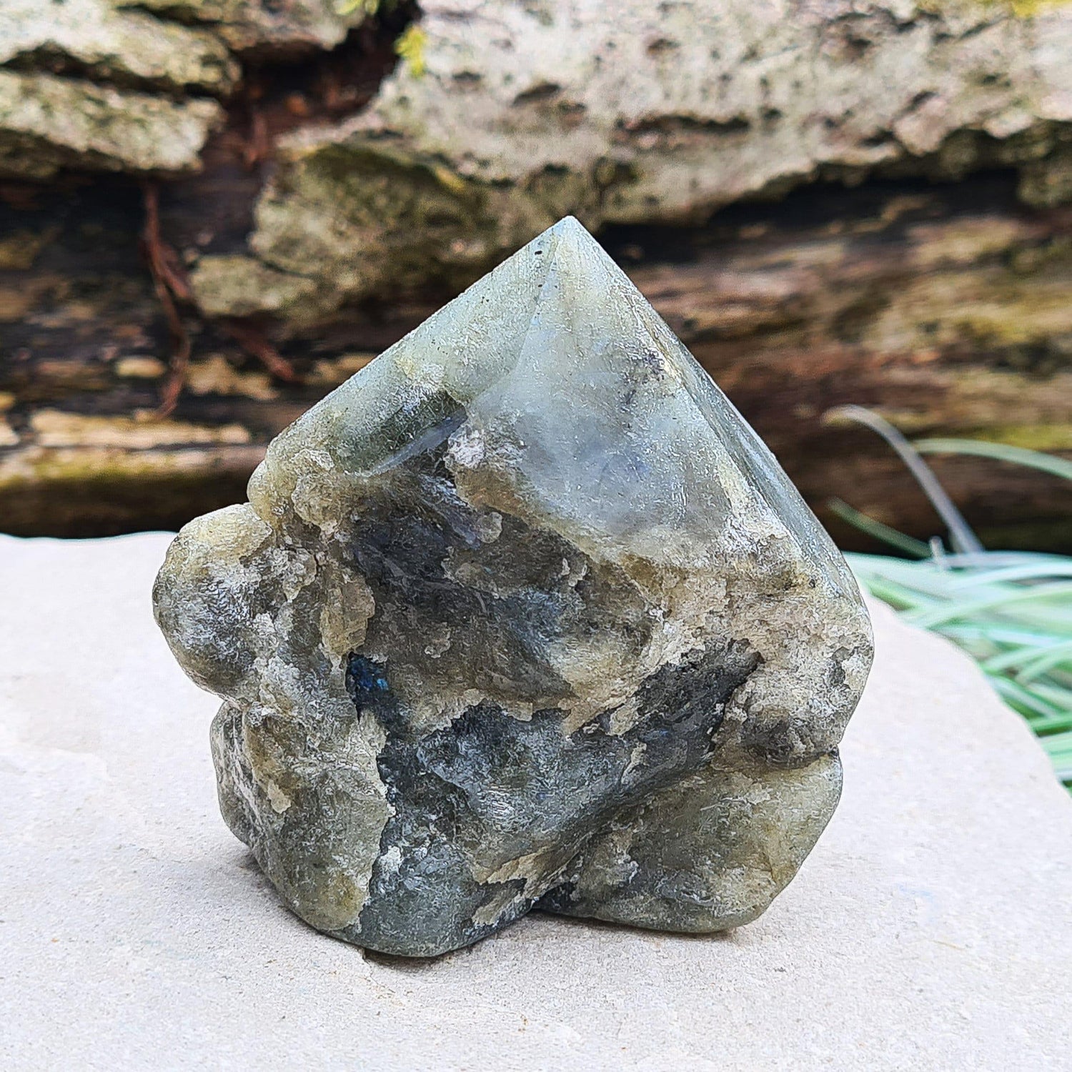 Labradorite Crystal, Standing Point, also known as Spectrolite. Tip has been polished, base has been polished and the natural sides feel like they have been smoothed out also. Piece has some blue flash which can be seen in the right light and at the right angle.