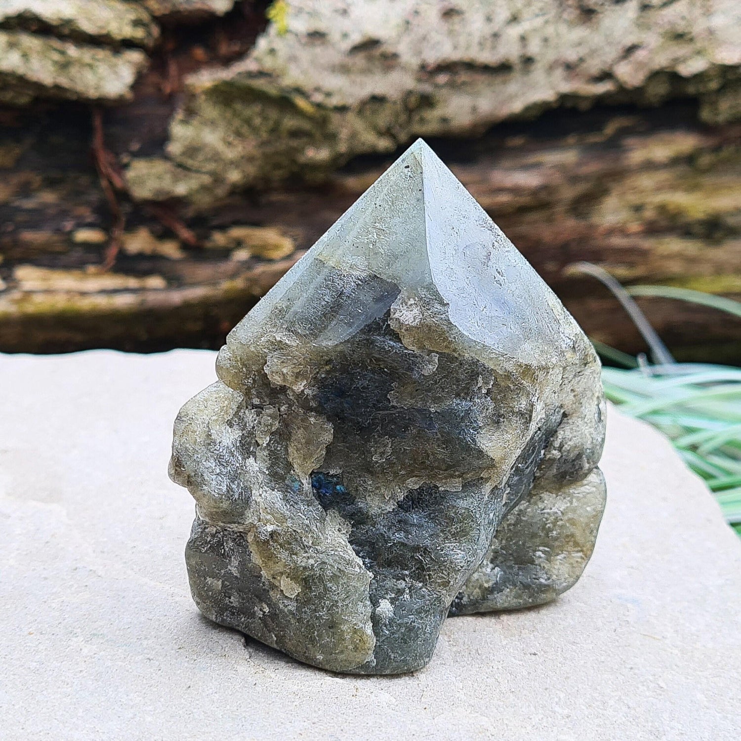 Labradorite Crystal, Standing Point, also known as Spectrolite. Tip has been polished, base has been polished and the natural sides feel like they have been smoothed out also. Piece has some blue flash which can be seen in the right light and at the right angle.