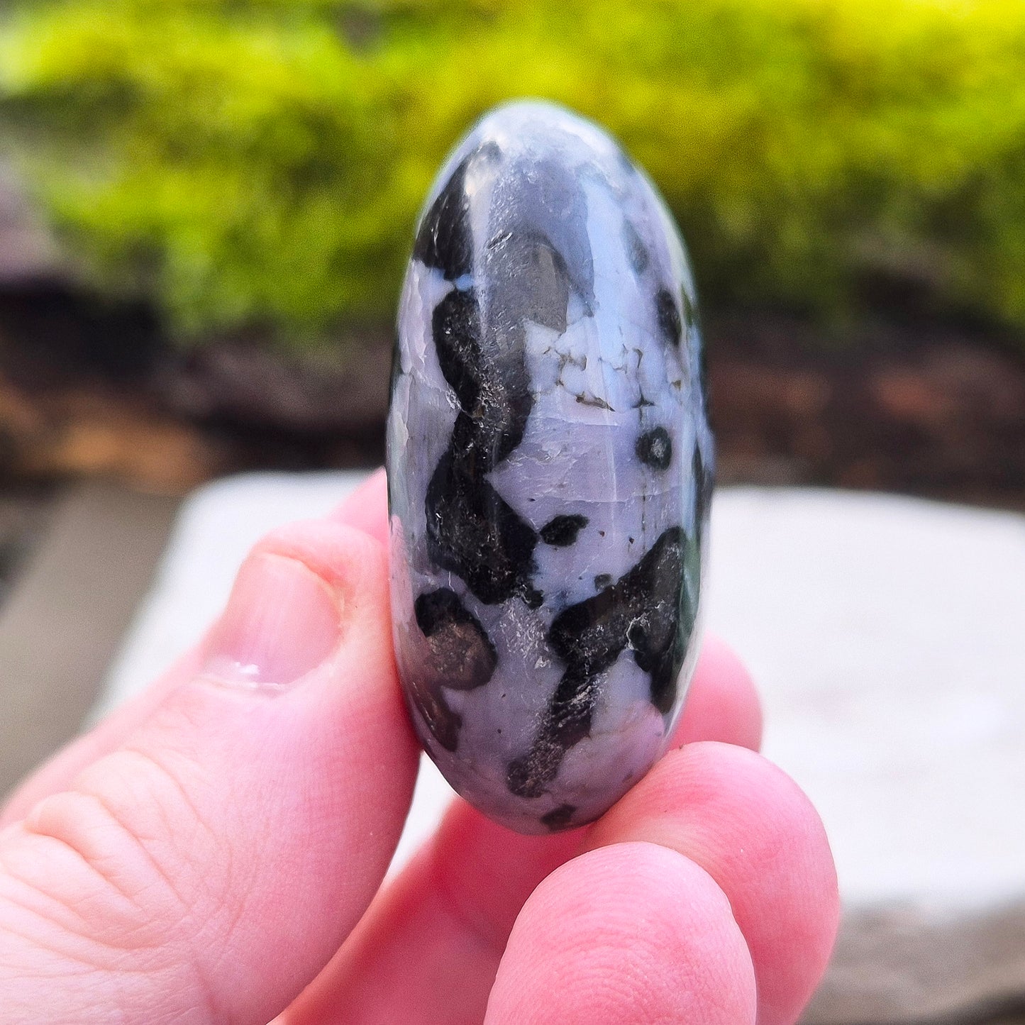 Indigo Gabbro Crystal Palm Stone, also known as Mystic Merlinite, originates from Madagascar. This a stunning stone formed deep within the Earth when molten magma cools slowly. 