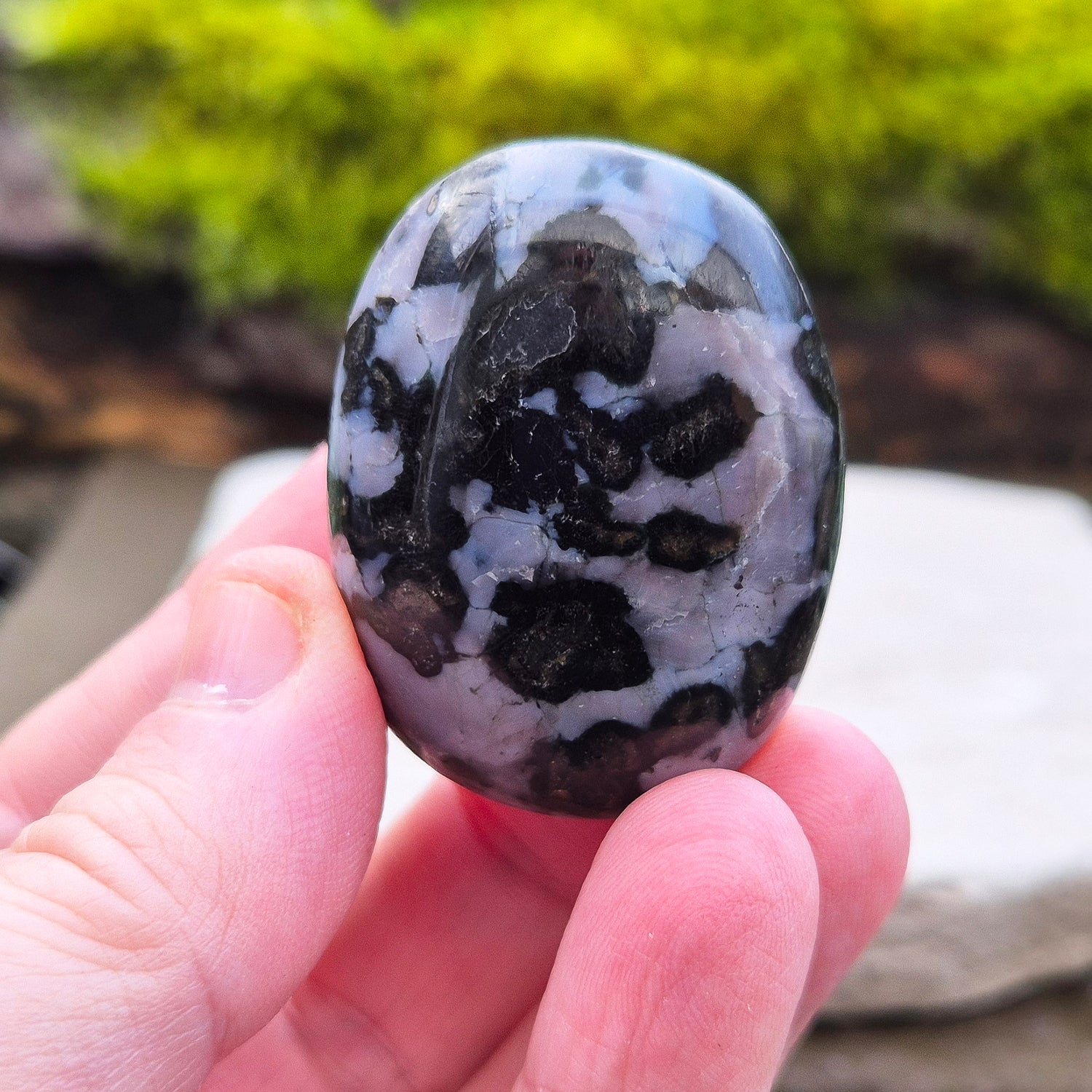 Indigo Gabbro Crystal Palm Stone, also known as Mystic Merlinite, originates from Madagascar. This a stunning stone formed deep within the Earth when molten magma cools slowly. 