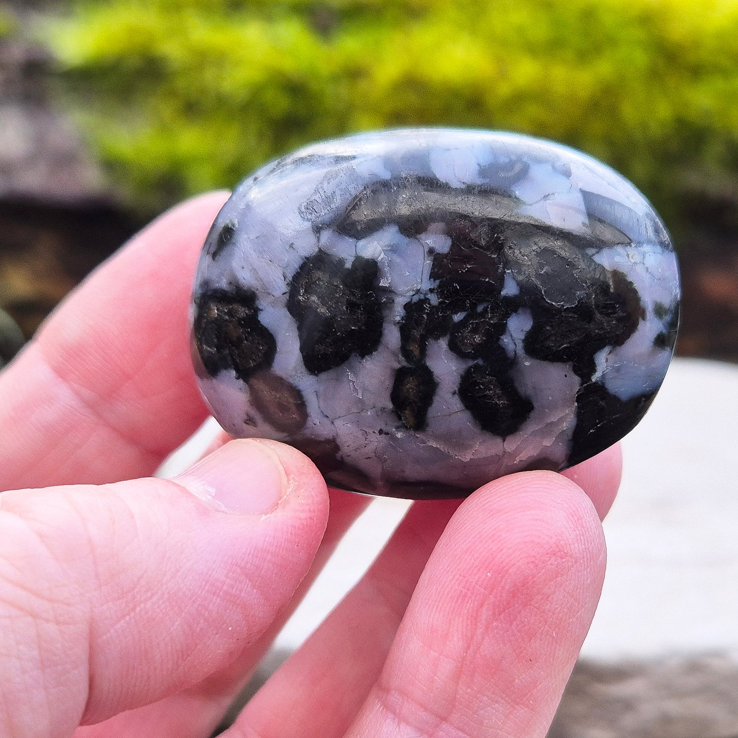 Indigo Gabbro Crystal Palm Stone, also known as Mystic Merlinite, originates from Madagascar. This a stunning stone formed deep within the Earth when molten magma cools slowly. 