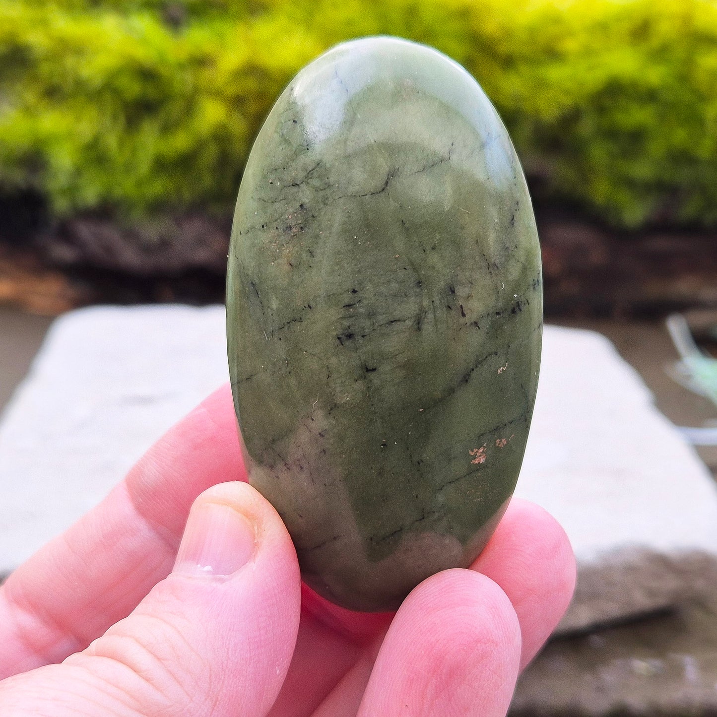 Nephrite Jade Crystal Palm Stone with black spots. From Pakistan. Lovely smooth polish, classic green Nephrite Jade colour.