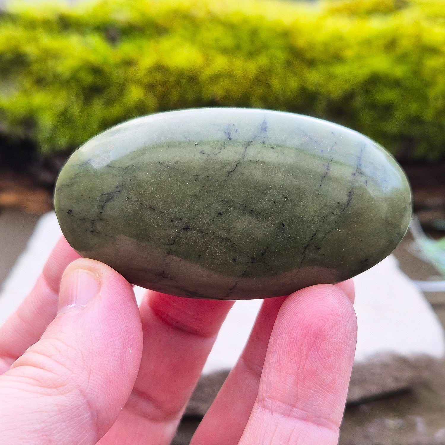 Nephrite Jade Crystal Palm Stone with black spots. From Pakistan. Lovely smooth polish, classic green Nephrite Jade colour.