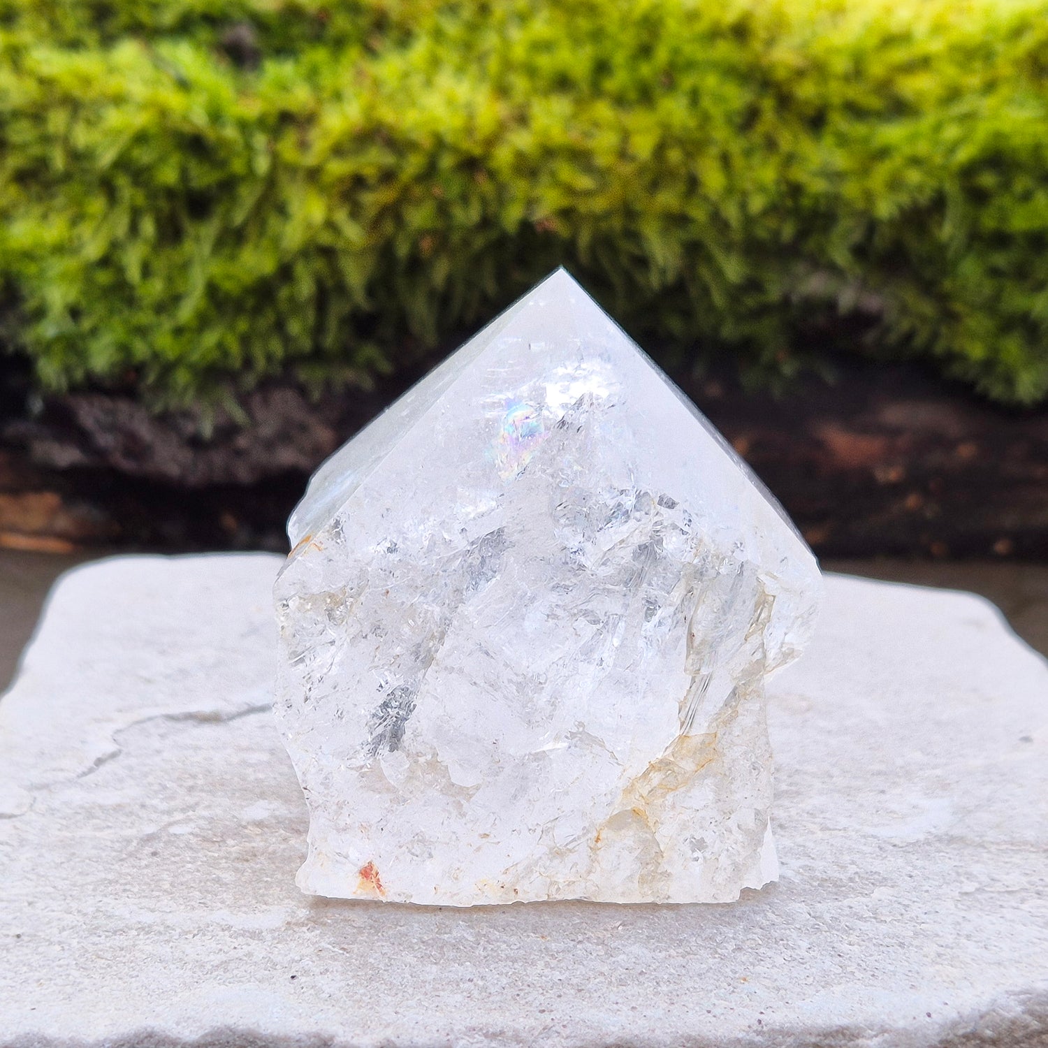 Quartz Crystal Standing Point,&nbsp;from Brazil. Point is polished at tip with a rainbow, sides are natural and the base is cut flat so it will sit on an even surface. Lovely clarity and light refraction within it.