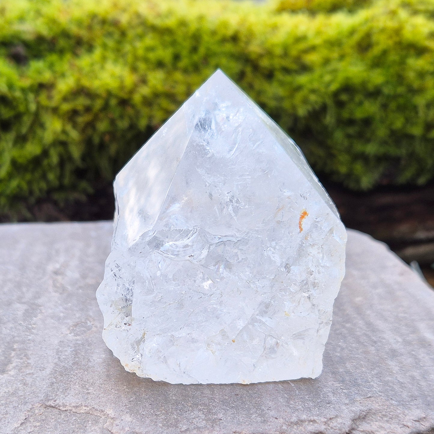 Quartz Crystal Standing Point,&nbsp;from Brazil. Point is polished at tip with a rainbow, sides are natural and the base is cut flat so it will sit on an even surface. Lovely clarity and light refraction within it.