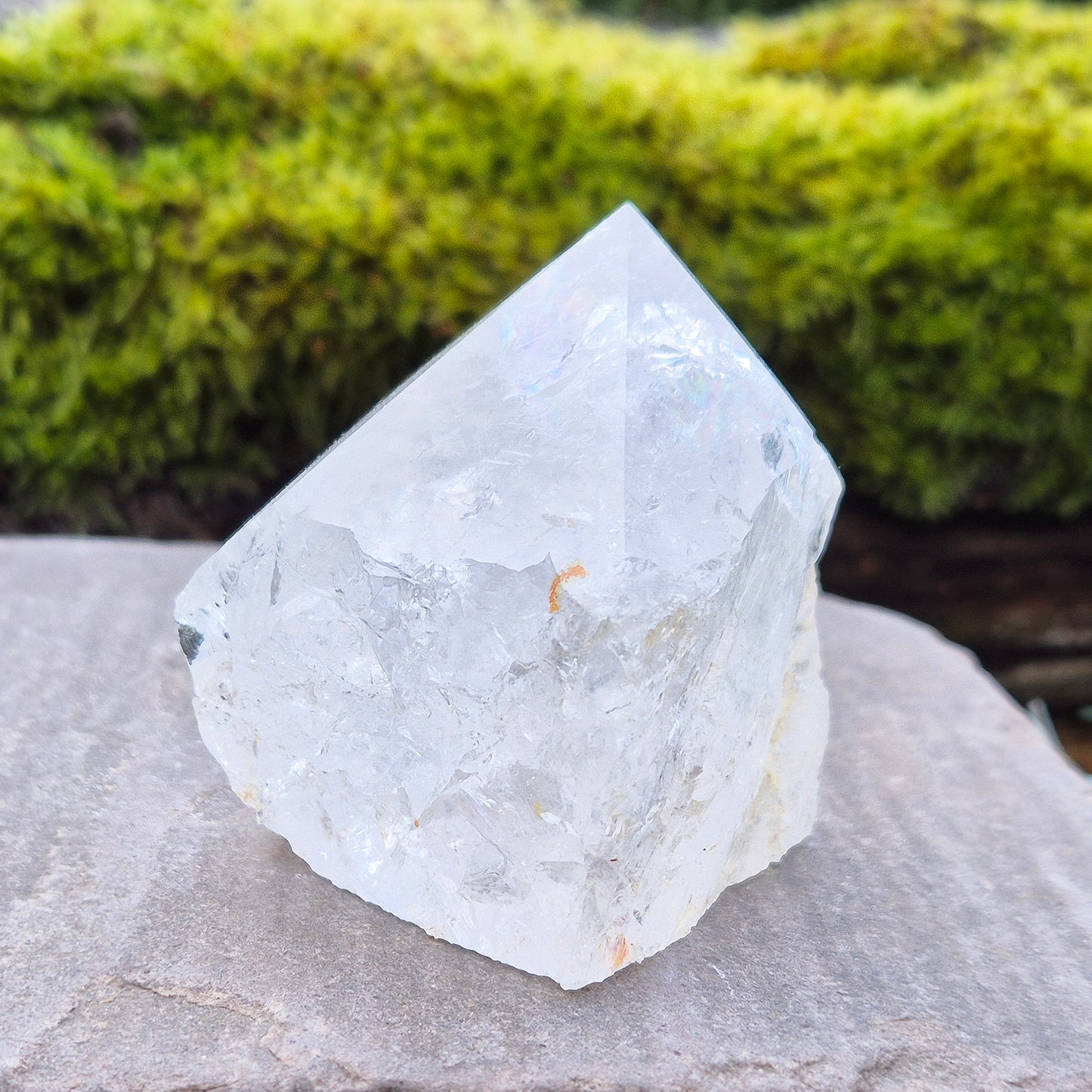 Quartz Crystal Standing Point,&nbsp;from Brazil. Point is polished at tip with a rainbow, sides are natural and the base is cut flat so it will sit on an even surface. Lovely clarity and light refraction within it.