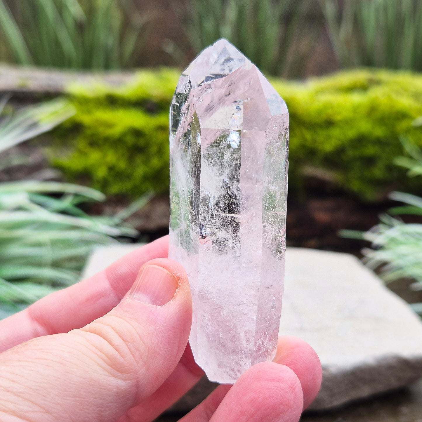 Quartz Crystal Point with a significant light reflecting incusion at the tip. From Brazil. This is a wonderfully natural quartz point with nice clarity.