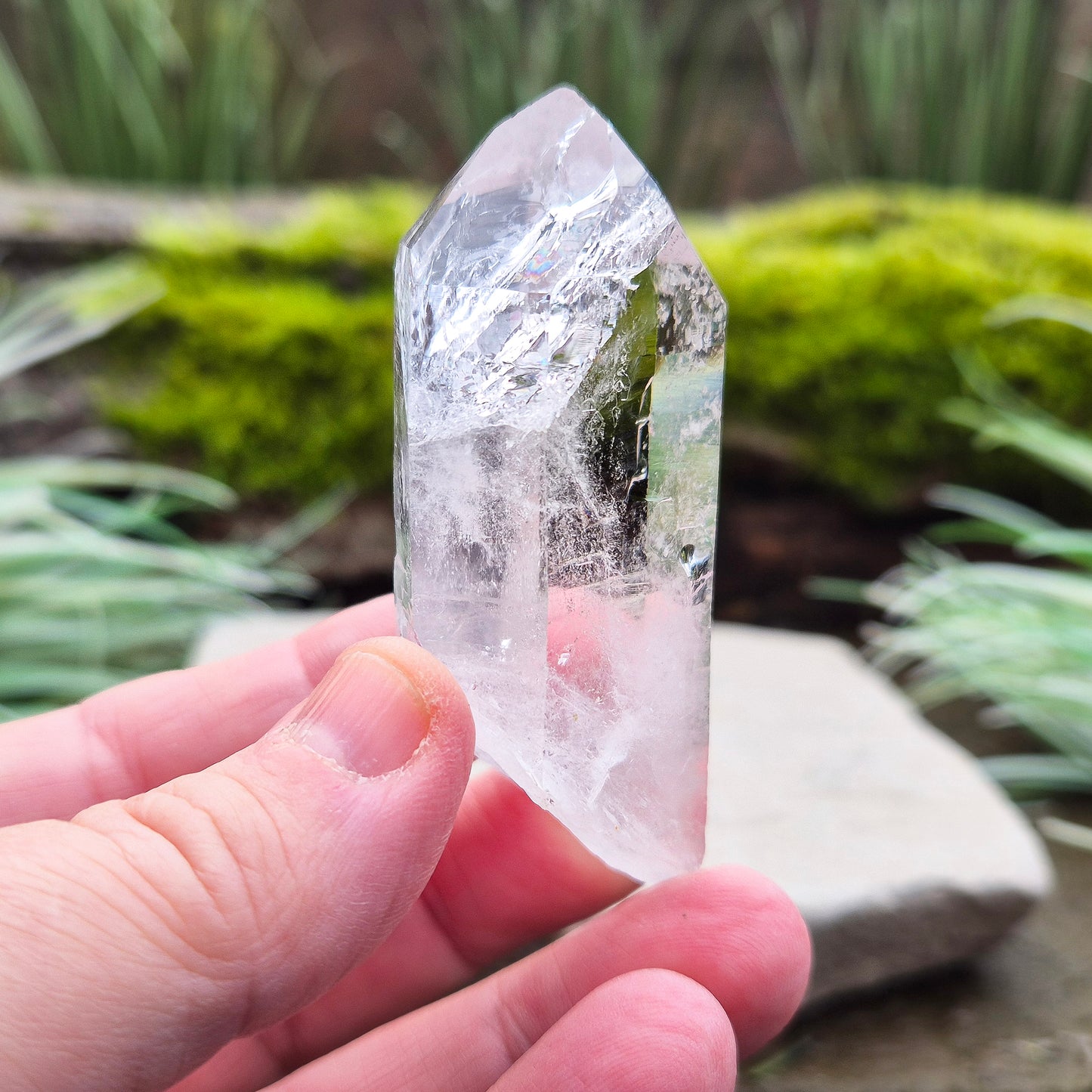 Quartz Crystal Point with a significant light reflecting incusion at the tip. From Brazil. This is a wonderfully natural quartz point with nice clarity.