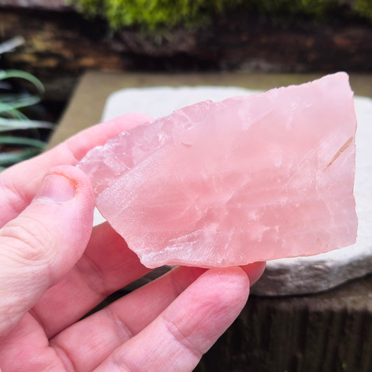 Rose Quartz Crystal Platform from South Africa. One side is left natural and the other side has been cut flat. 