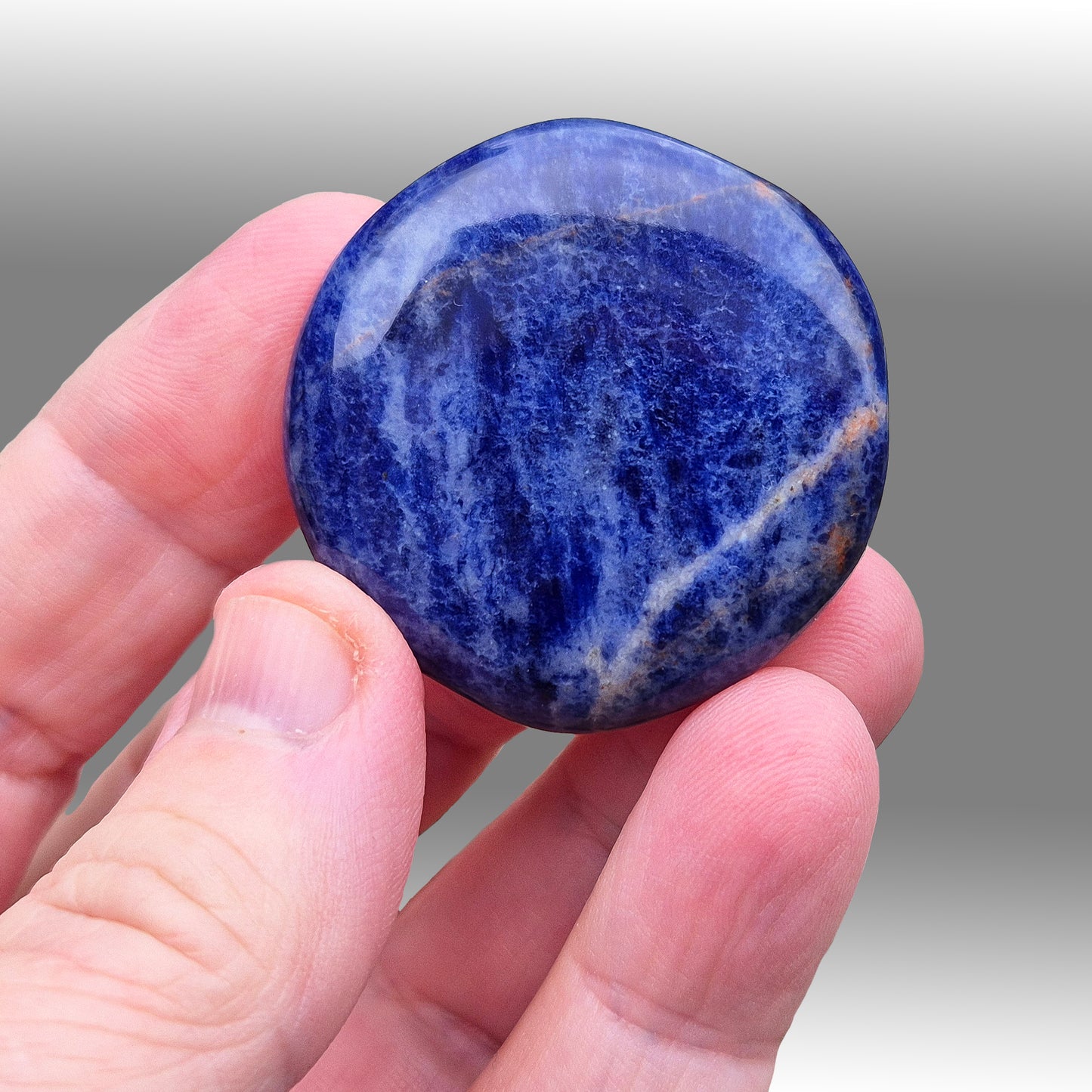 Sodalite Palm Stone. AA grade. From Namibia. Nice royal blue colouring and marking.