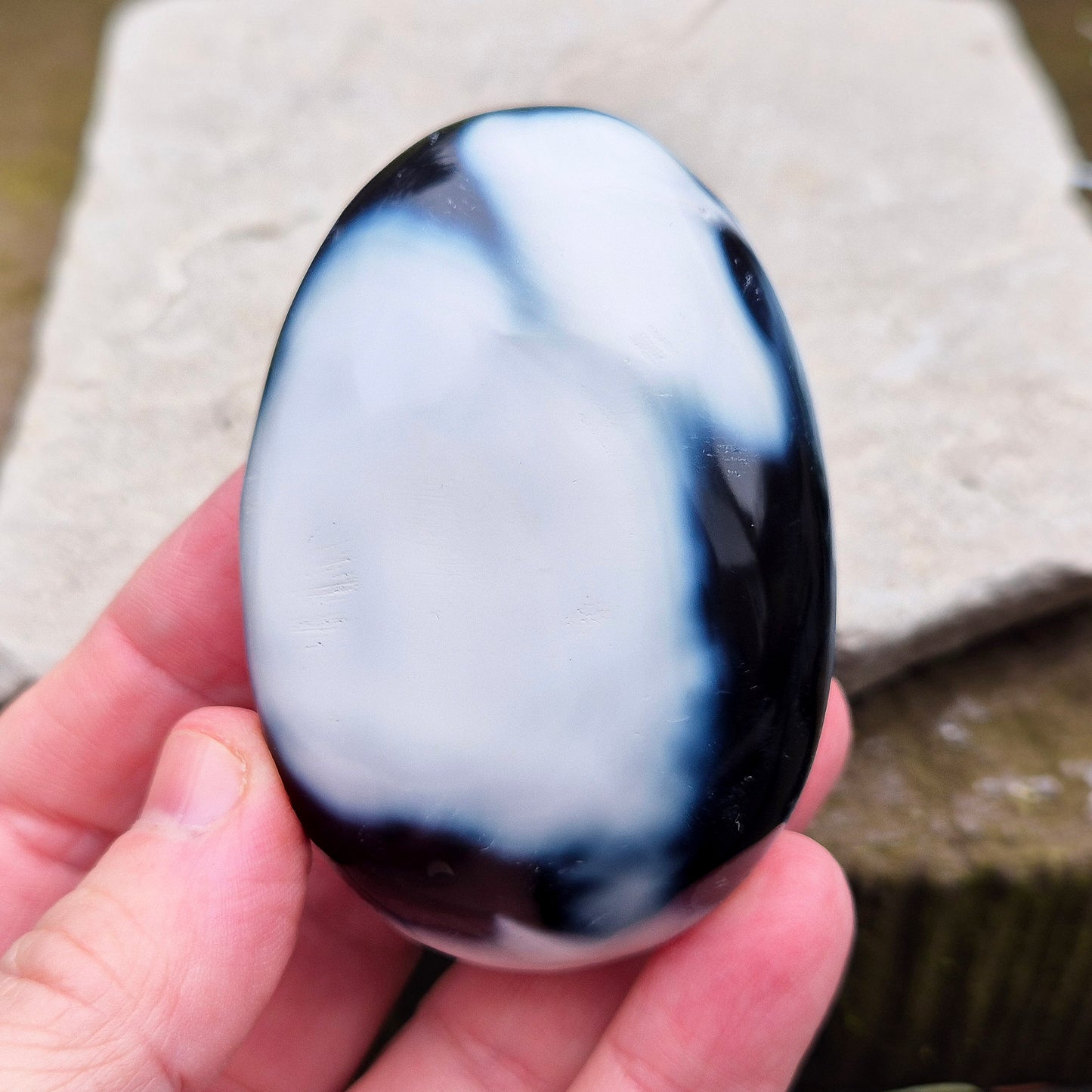 Orca Agate crystal pebble, originally from Madagascar, are also known as Grey Agate. This unique stone is named after the Orca whale due to its distinctive black and white markings.