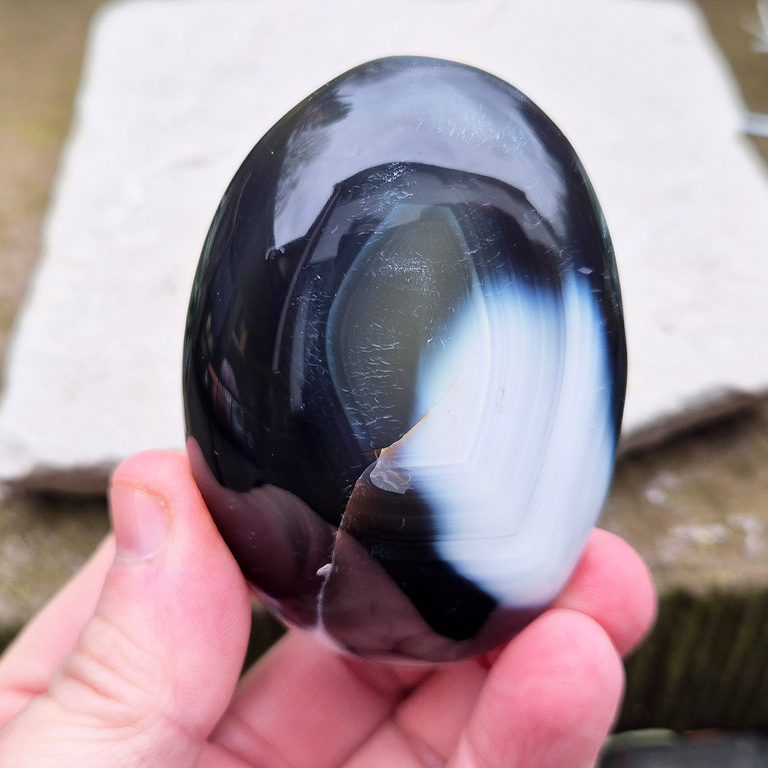 Orca Agate crystal pebble, originally from Madagascar, are also known as Grey Agate. This unique stone is named after the Orca whale due to its distinctive black and white markings.