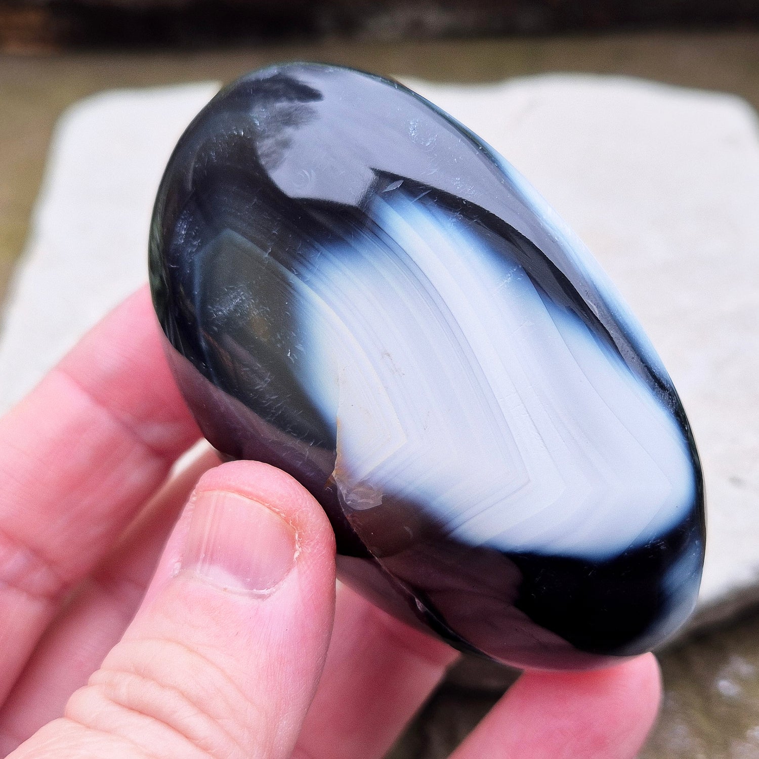 Orca Agate crystal pebble, originally from Madagascar, are also known as Grey Agate. This unique stone is named after the Orca whale due to its distinctive black and white markings.