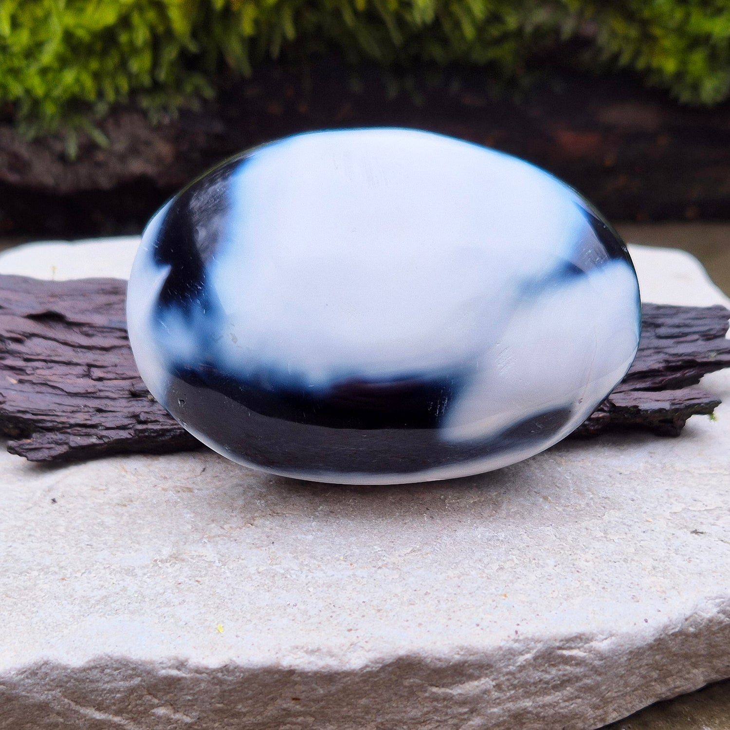 Orca Agate crystal pebble, originally from Madagascar, are also known as Grey Agate. This unique stone is named after the Orca whale due to its distinctive black and white markings.