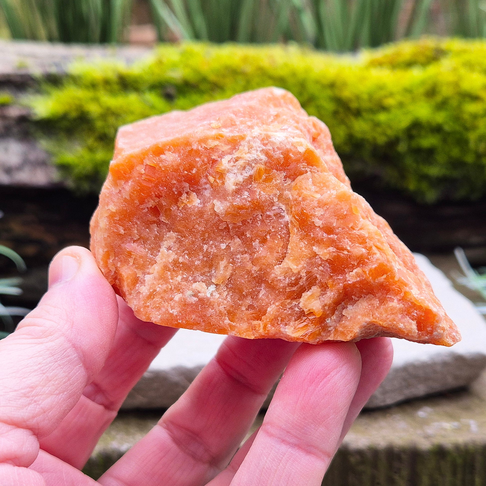 Orange Calcite, Natural Piece, Vibrant Color. While this crystal comes from a vein in the mine known for producing an infusion of orange calcite and black tourmaline, this piece appears to outwardly feature only the vibrant orange calcite.