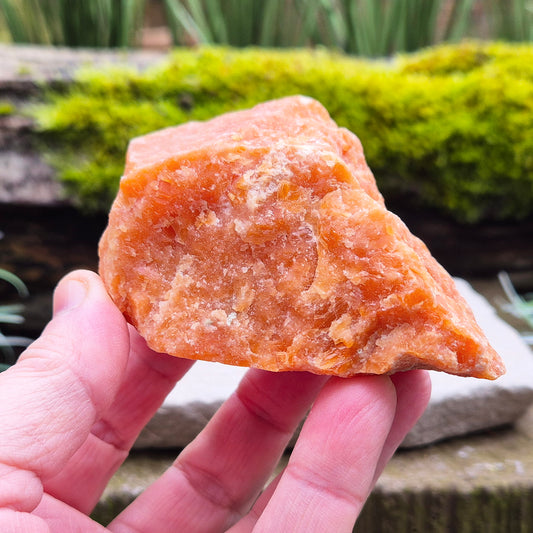Orange Calcite, Natural Piece, Vibrant Color. While this crystal comes from a vein in the mine known for producing an infusion of orange calcite and black tourmaline, this piece appears to outwardly feature only the vibrant orange calcite.