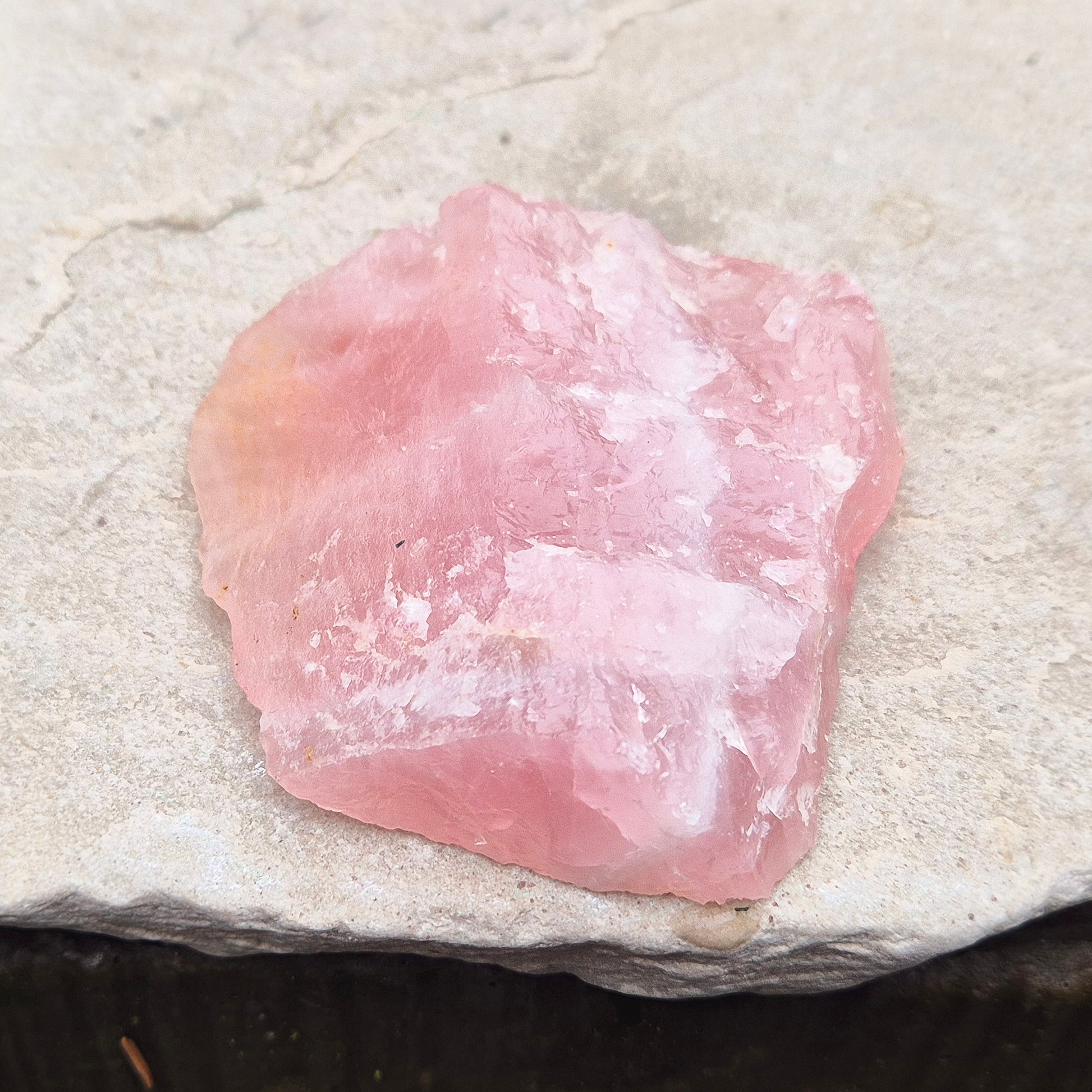 Rose Quartz Crystal Platform from South Africa. One side is left natural and the other side has been cut flat. Great for displaying other crystals and jewellry. 