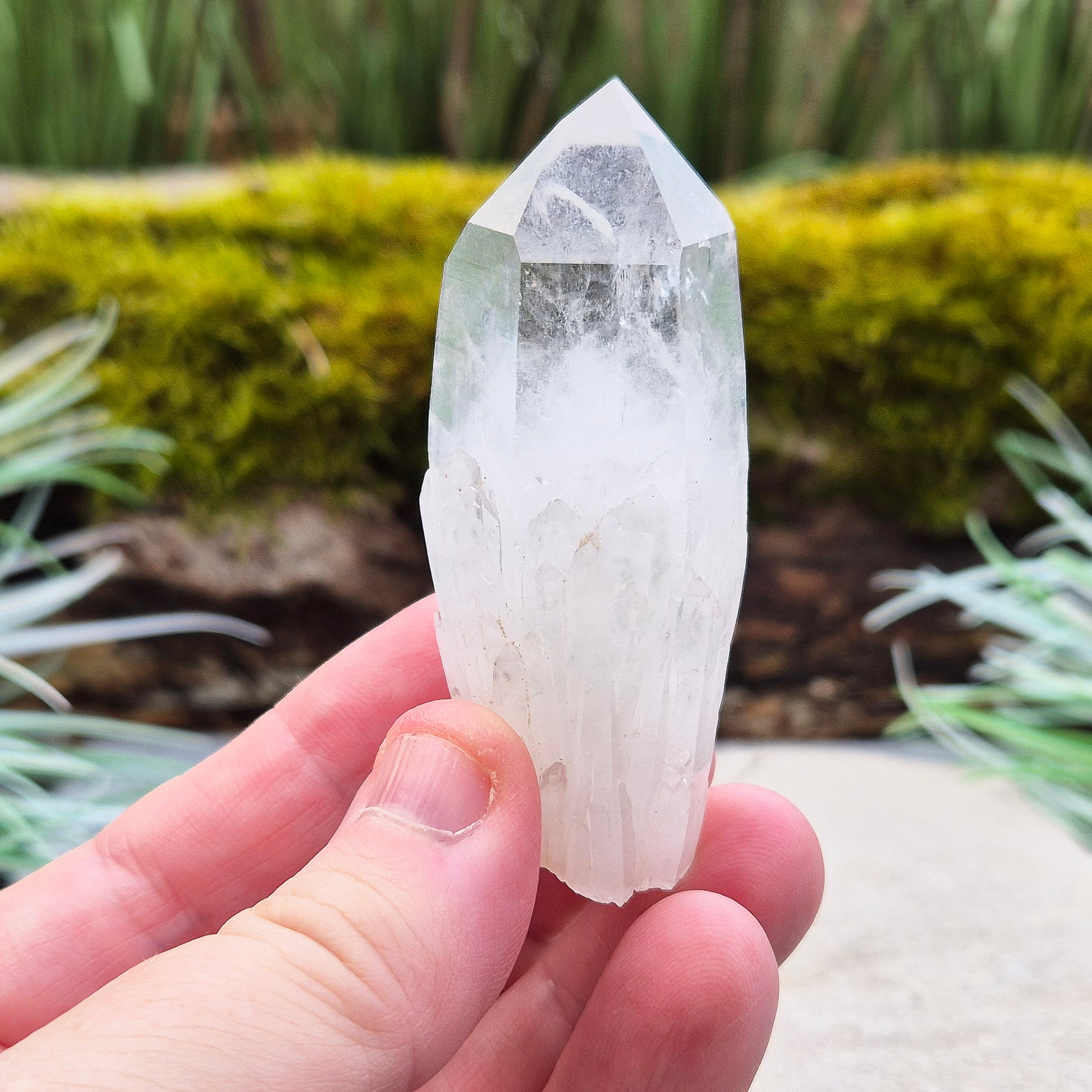 Quartz Crystal Point. From Atlas Mountains, Morocco. This is a wonderful natural quartz point with lots of companion crystals growing around it, very much like the formations you get on Pineapple Quartz.