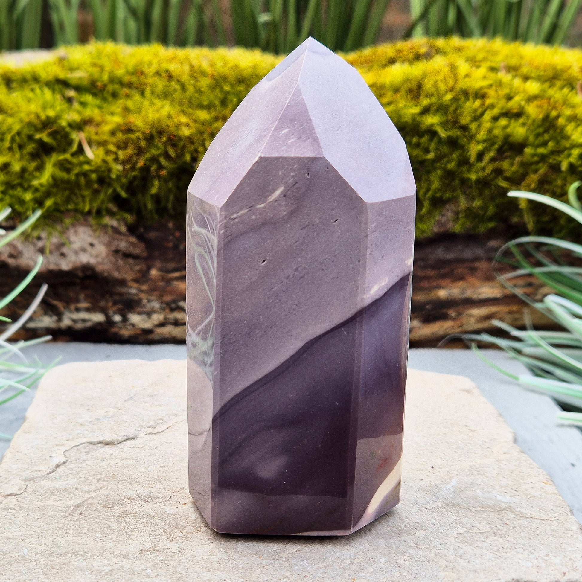 This striking Mookaite point features a rare purple gradient and a six-sided shape (7-3-7-3-7-3) that channels energy upward and outward. Known as a stone of strength, adaptability, and calm focus, Mookaite supports grounded growth and helps you move through change with confidence and ease.