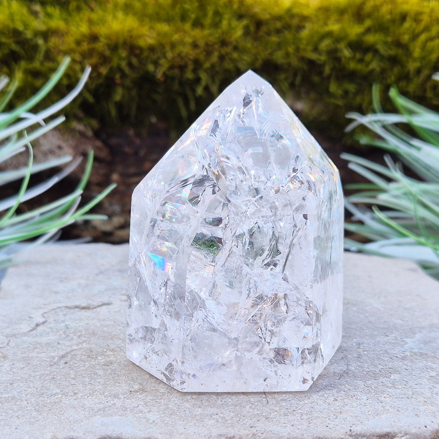 Fire and Ice Quartz Polished Standing Point (also known as Rainbow Quartz) is created by heating and rapidly cooling quartz. This results in a crystal with a high vibration, reflective inclusions, and occasional rainbows, all contributing to the vibrant light within the crystal.