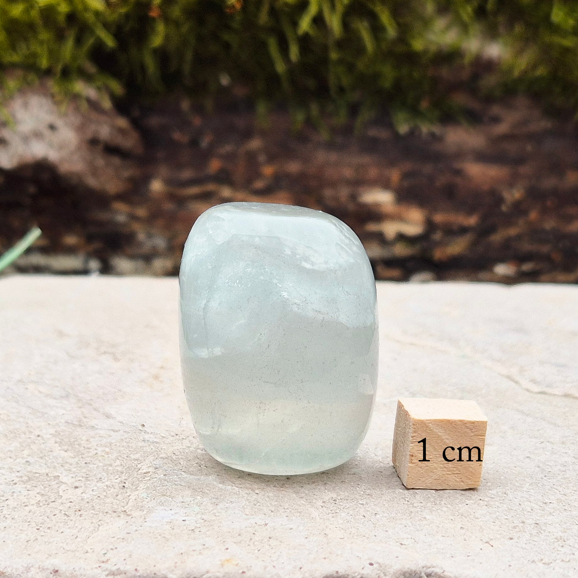 Green Fluorite Crystal. This crystal features a smooth, polished barrel-like shape with softly rounded edges, and will stand upright. From China.