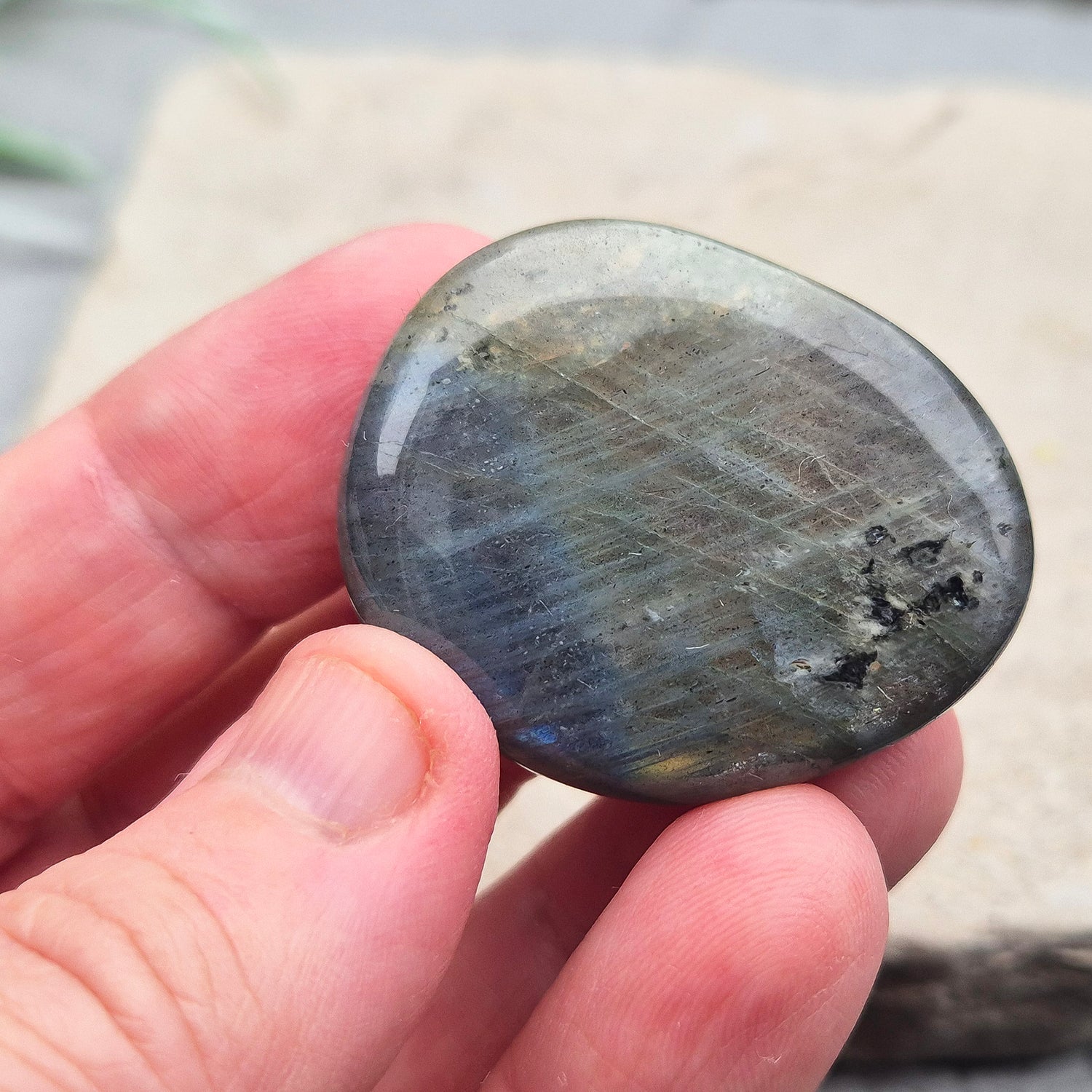 Labradorite Crystal Palm Stone, also known as Spectrolite. From Madagaascar. Has a lovely blue, yellow, gold, pinky purple flash when in the light at certain angles.