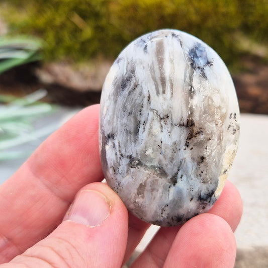 Shop Dendritic Opal Palm Stones for grounding, intuition, and spiritual growth. Handcrafted, polished, and energy-cleansed crystals from Madagascar.