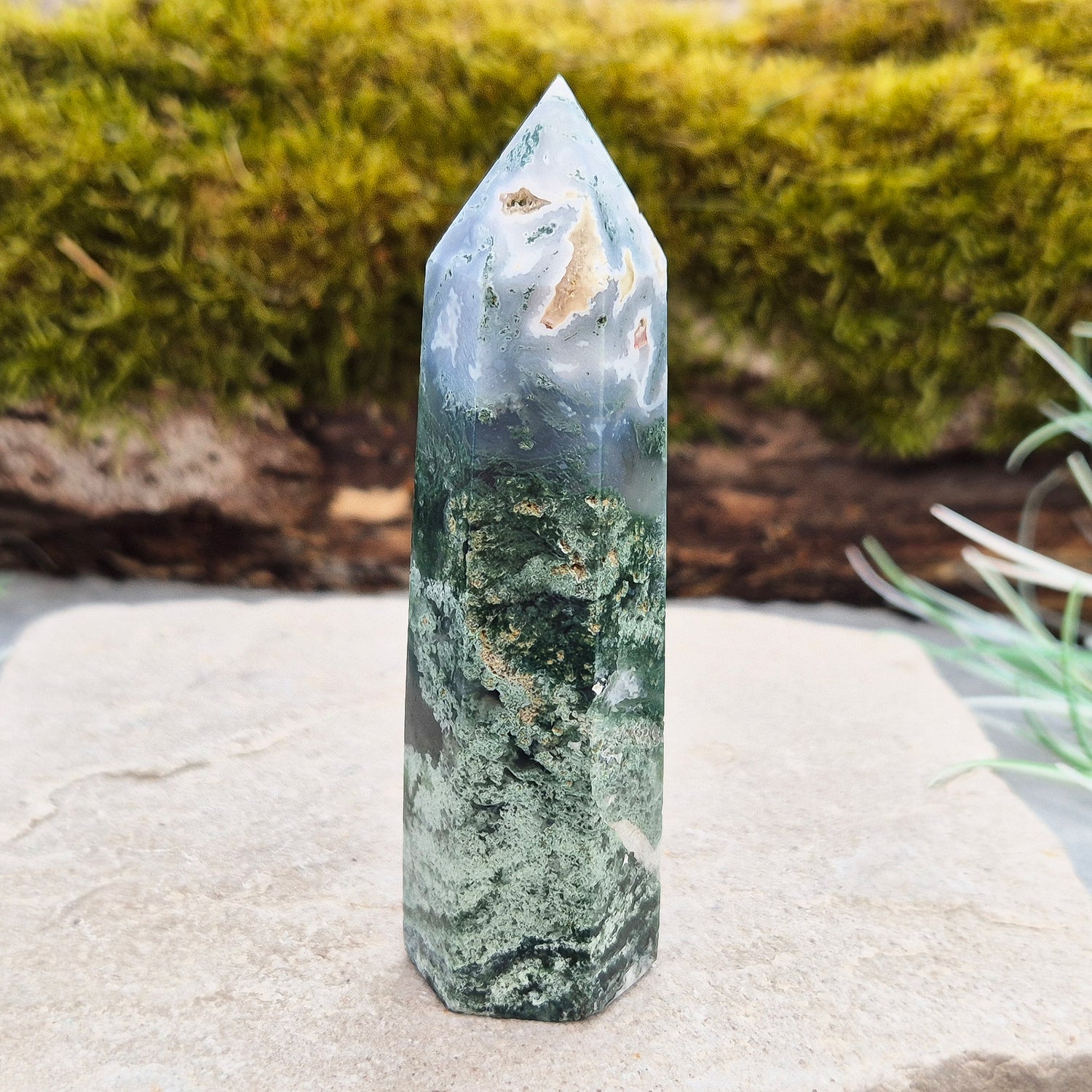 This exquisite Moss Agate Tower features a 6 sided Generator tip, polished surface with unique moss-like inclusions, creating a captivating natural design. 