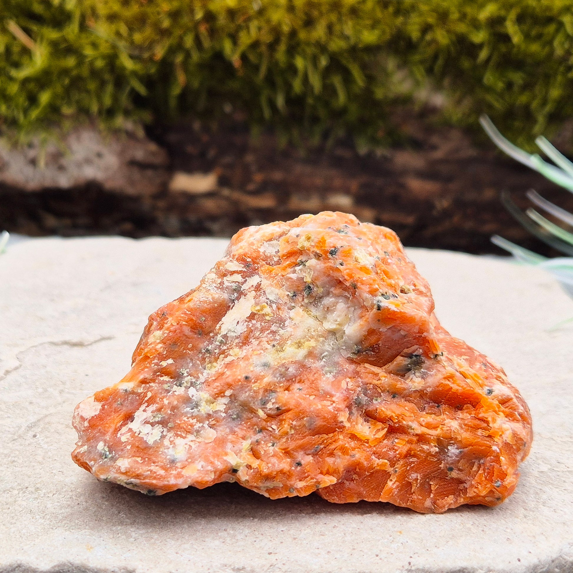 Orchid Calcite Crystal – a natural blend of Orange Calcite and Black Tourmaline. Perfect for adding energy and style to your home or workspace.