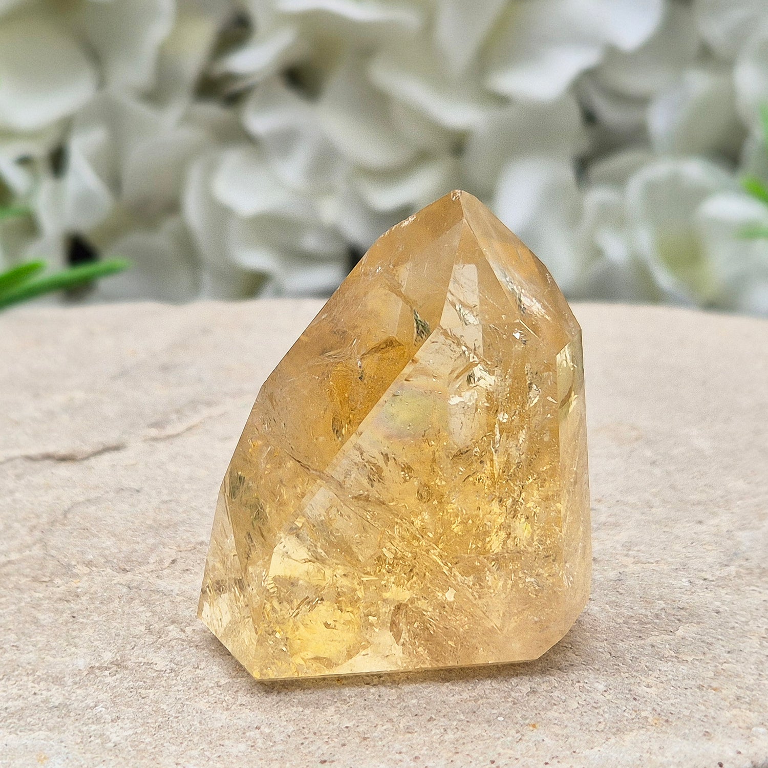 Natural Untreated polished Citrine Point sourced and polished in Brazil. Wonderful golden citrine colour with a fabulous rainbow and light reflecting inclusions. Finding natural citrine is becoming more difficult so I am delighted to have this piece.