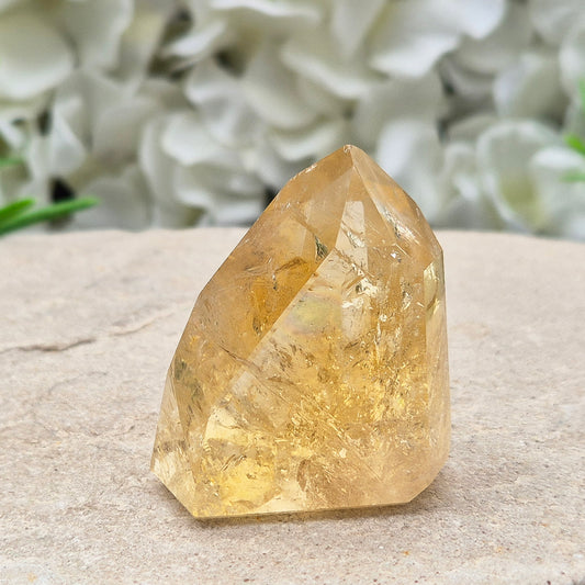 Natural Untreated polished Citrine Point sourced and polished in Brazil. Wonderful golden citrine colour with a fabulous rainbow and light reflecting inclusions. Finding natural citrine is becoming more difficult so I am delighted to have this piece.
