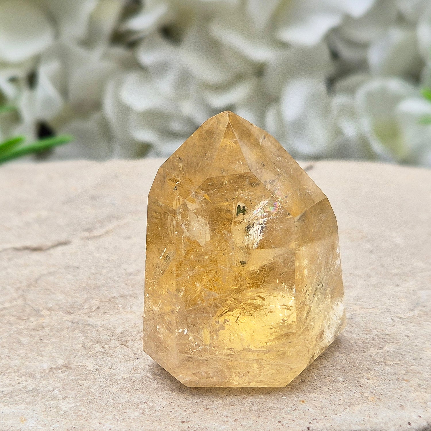 Natural Untreated polished Citrine Point sourced and polished in Brazil. Wonderful golden citrine colour with a fabulous rainbow and light reflecting inclusions. Finding natural citrine is becoming more difficult so I am delighted to have this piece.
