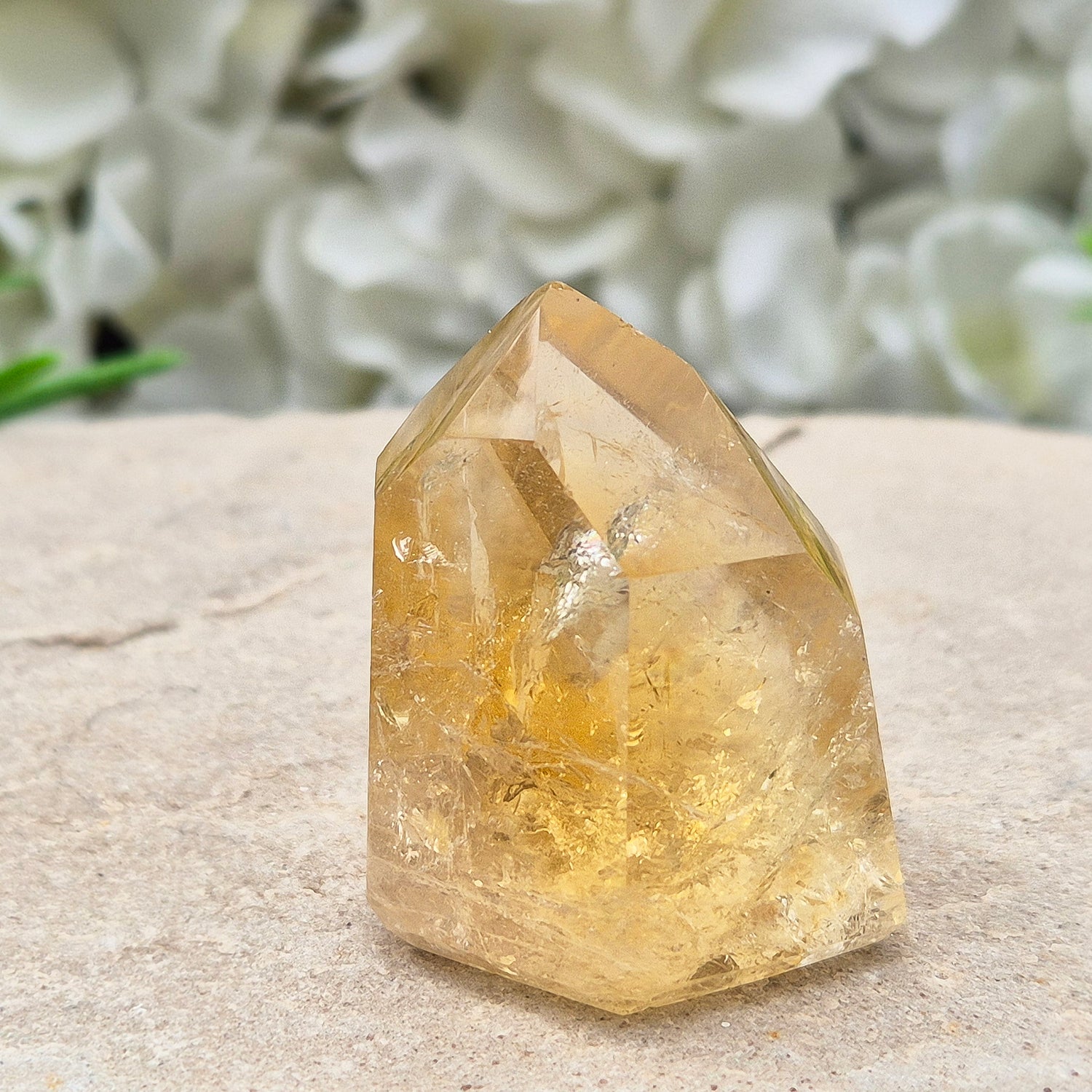 Natural Untreated polished Citrine Point sourced and polished in Brazil. Wonderful golden citrine colour with a fabulous rainbow and light reflecting inclusions. Finding natural citrine is becoming more difficult so I am delighted to have this piece.