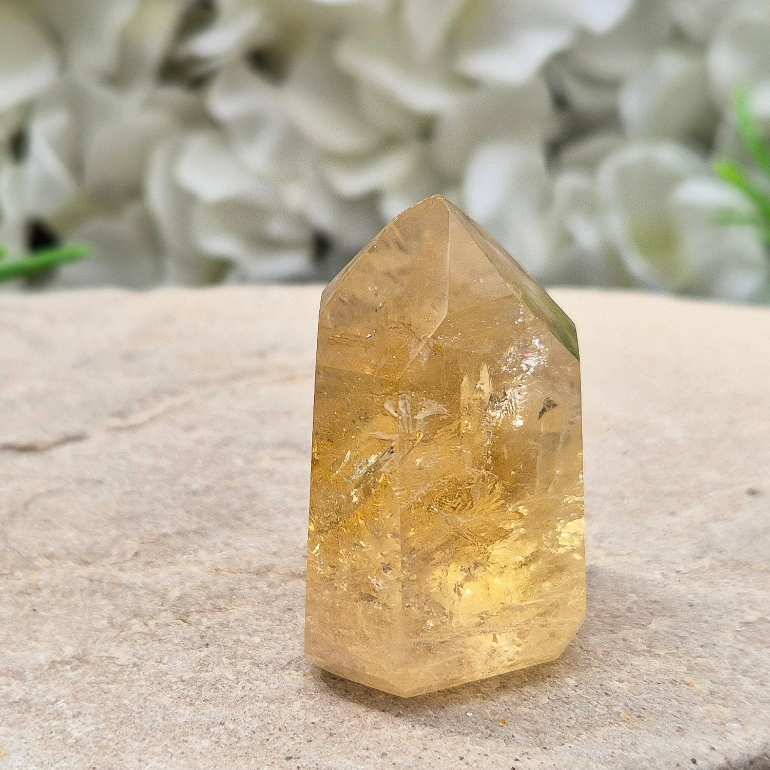 Natural Untreated polished Citrine Point sourced and polished in Brazil. Wonderful golden citrine colour with a fabulous rainbow and light reflecting inclusions. Finding natural citrine is becoming more difficult so I am delighted to have this piece.