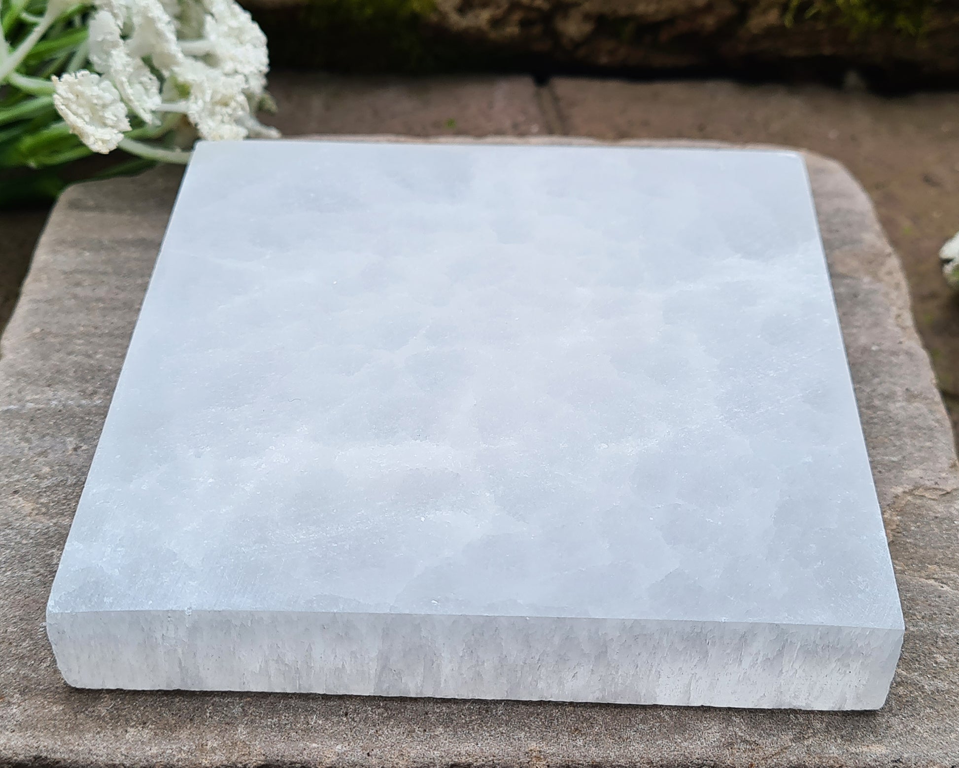 These fully polished Selenite plates are perfect for cleansing and recharging your crystals. Simply place your stones on the plate — Selenite naturally clears stagnant or negative energy and revitalises their energy. It also makes a lovely display base for showcasing your favourite crystals.