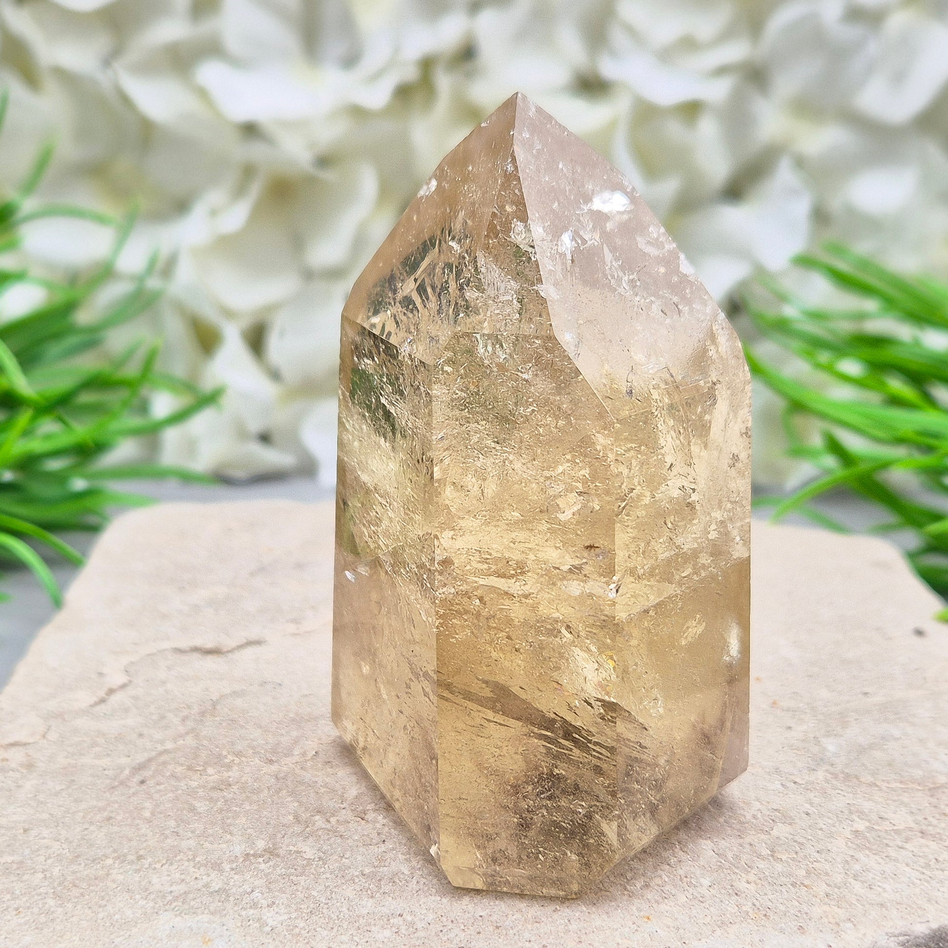 Natural Untreated polished Citrine Point sourced and polished in Brazil. Wonderful citrine colour with light reflecting inclusions and I have seen a few rainbows within it. Finding natural citrine is becoming more difficult so I am delighted to have this piece.