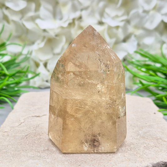 Natural Untreated polished Citrine Point sourced and polished in Brazil. Wonderful citrine colour with light reflecting inclusions and I have seen a few rainbows within it. Finding natural citrine is becoming more difficult so I am delighted to have this piece.