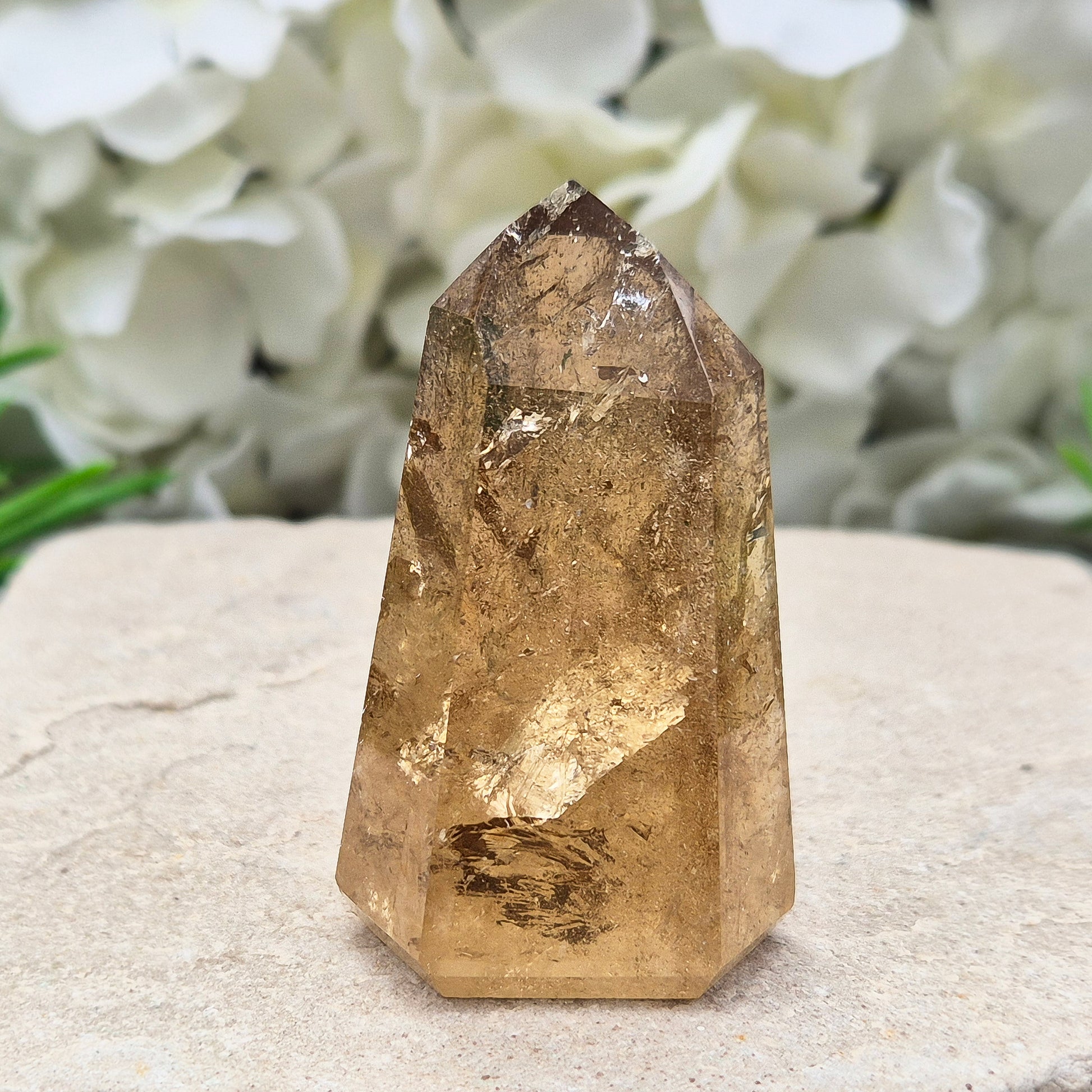 Natural Untreated polished Citrine Point sourced and polished in Brazil. Wonderful dark honey citrinecolour with light reflecting inclusions. 