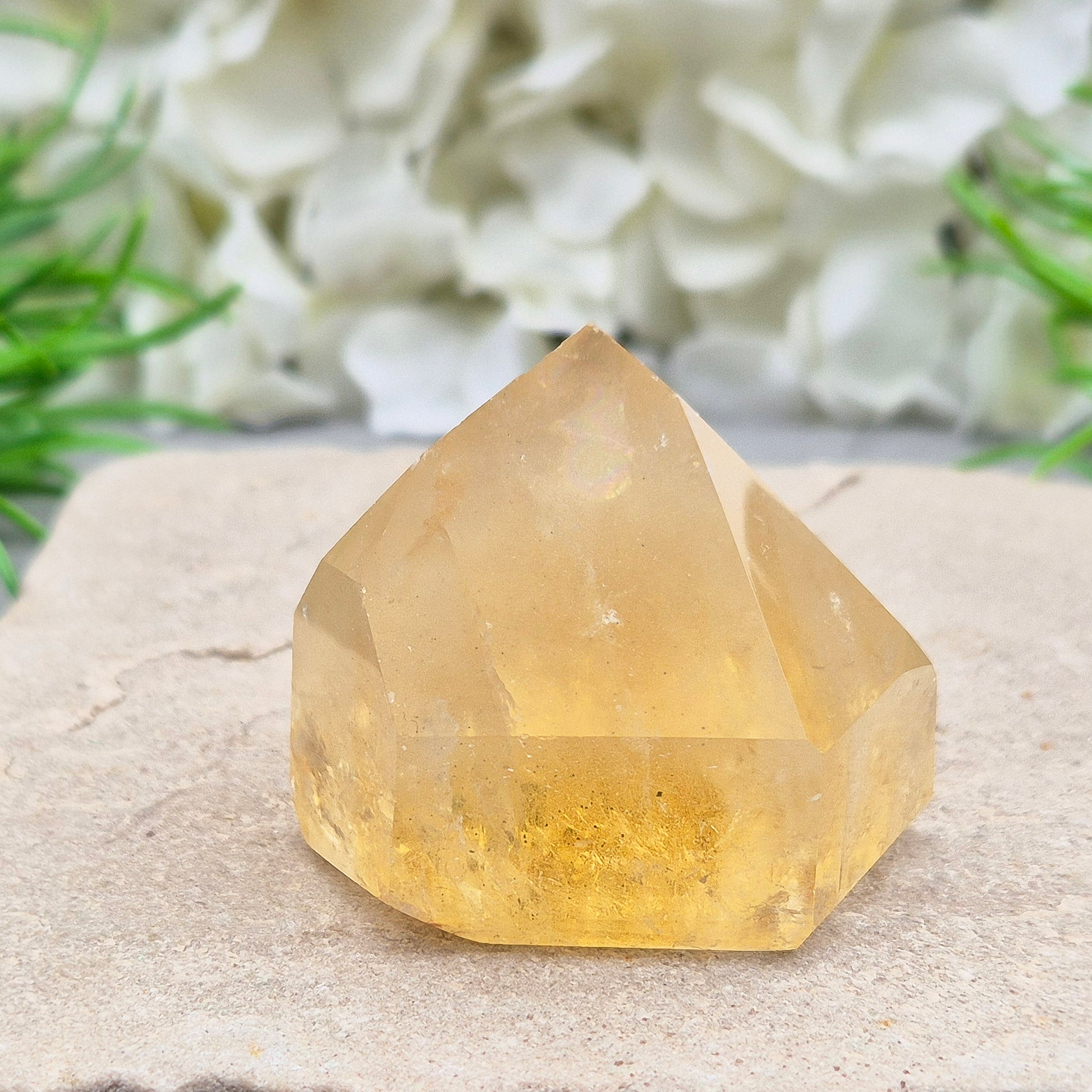 Natural Untreated polished Citrine Point sourced and polished in Brazil. Wonderful birght gold citrine colour with light reflecting inclusions and a raiunbow on the front face. 