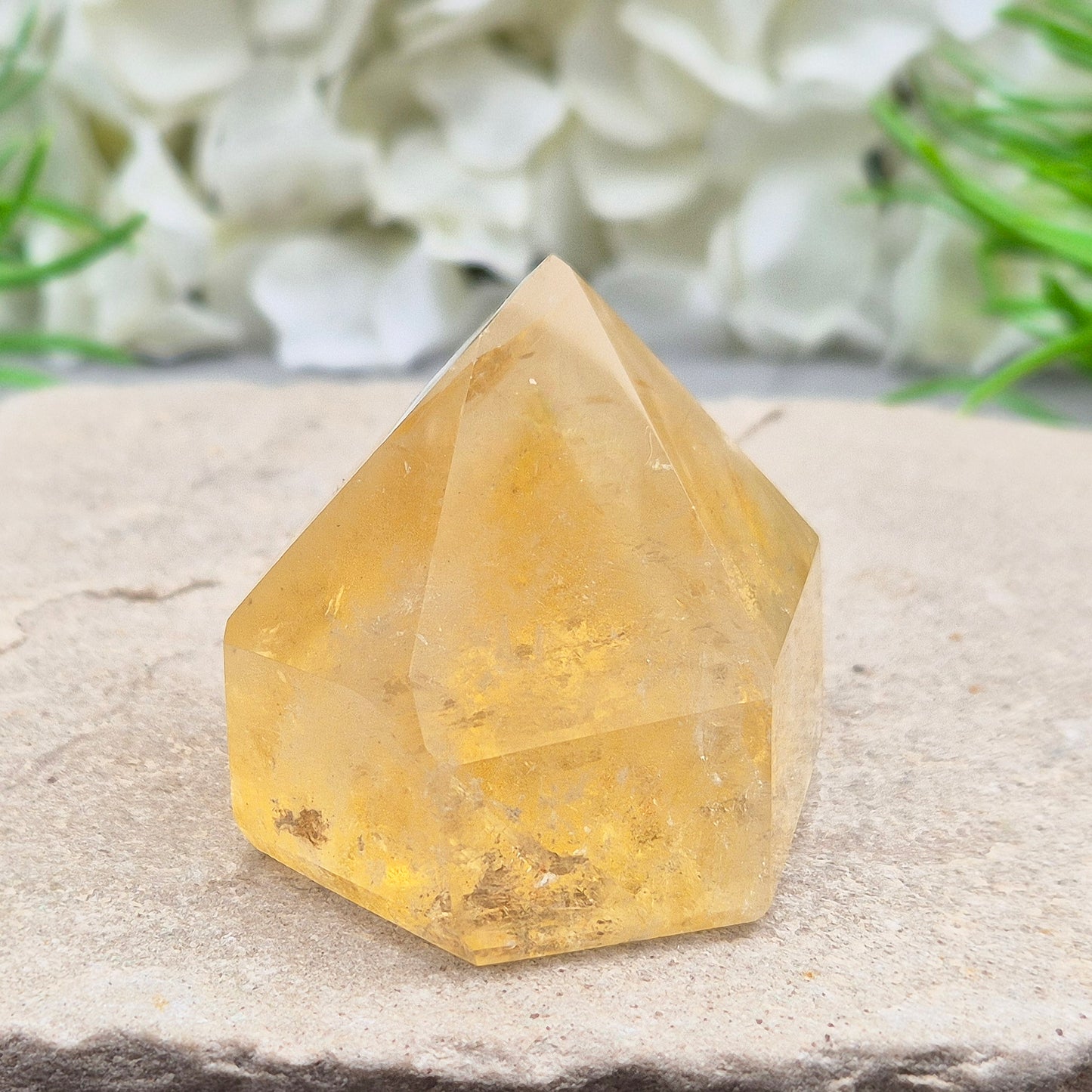 Natural Untreated polished Citrine Point sourced and polished in Brazil. Wonderful birght gold citrine colour with light reflecting inclusions and a raiunbow on the front face. 