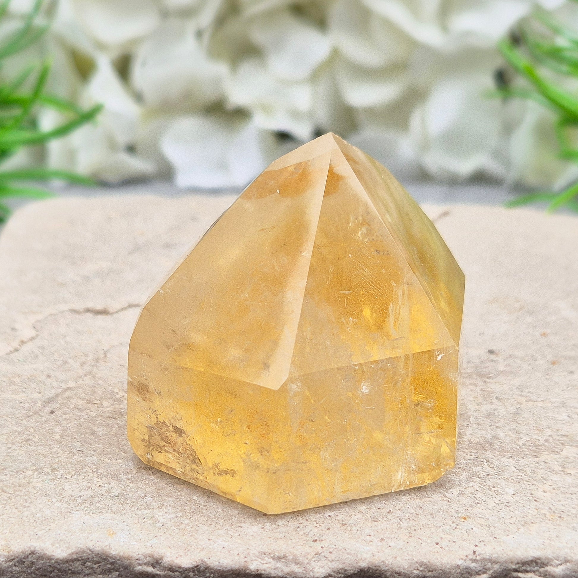 Natural Untreated polished Citrine Point sourced and polished in Brazil. Wonderful birght gold citrine colour with light reflecting inclusions and a raiunbow on the front face. 