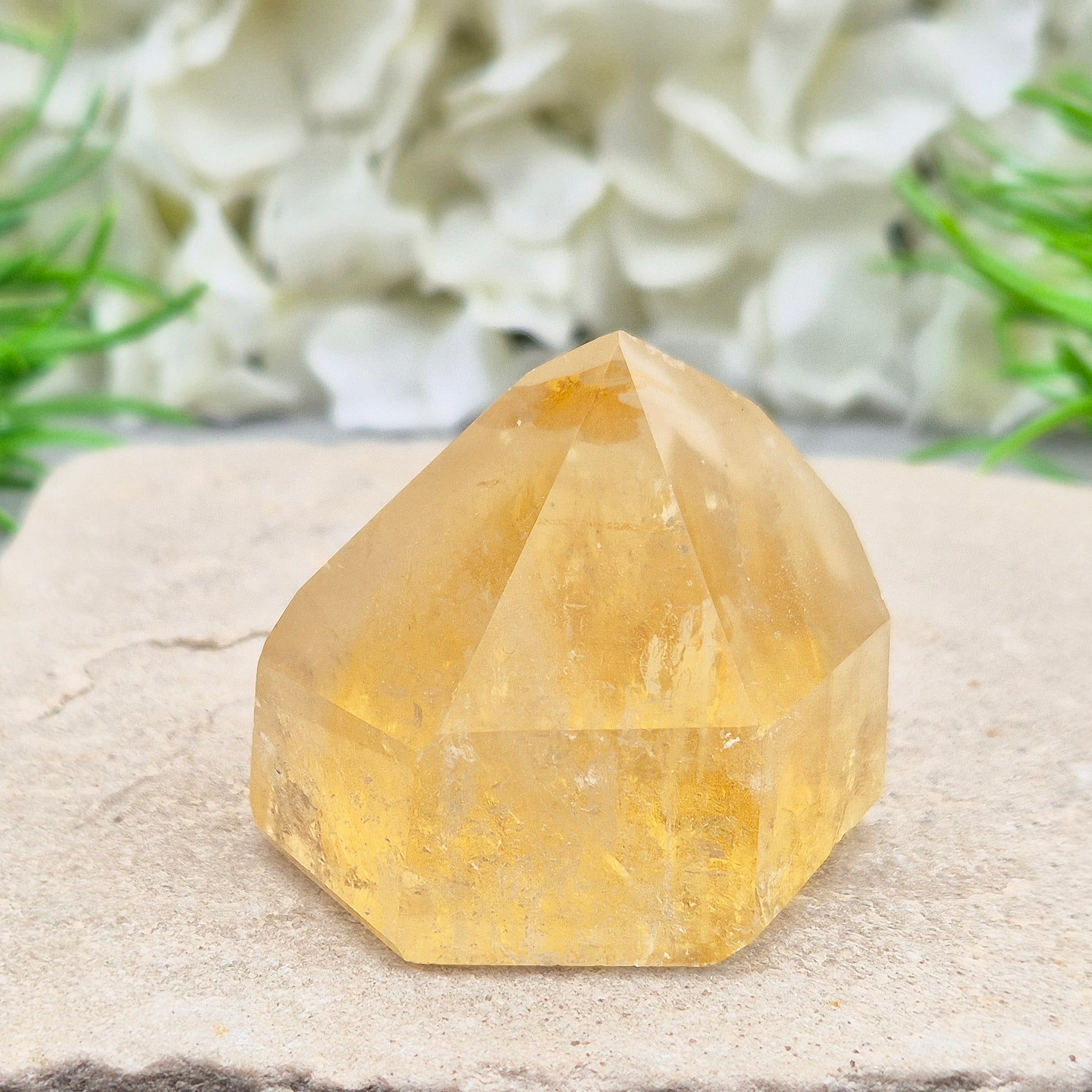 Natural Untreated polished Citrine Point sourced and polished in Brazil. Wonderful birght gold citrine colour with light reflecting inclusions and a raiunbow on the front face. 