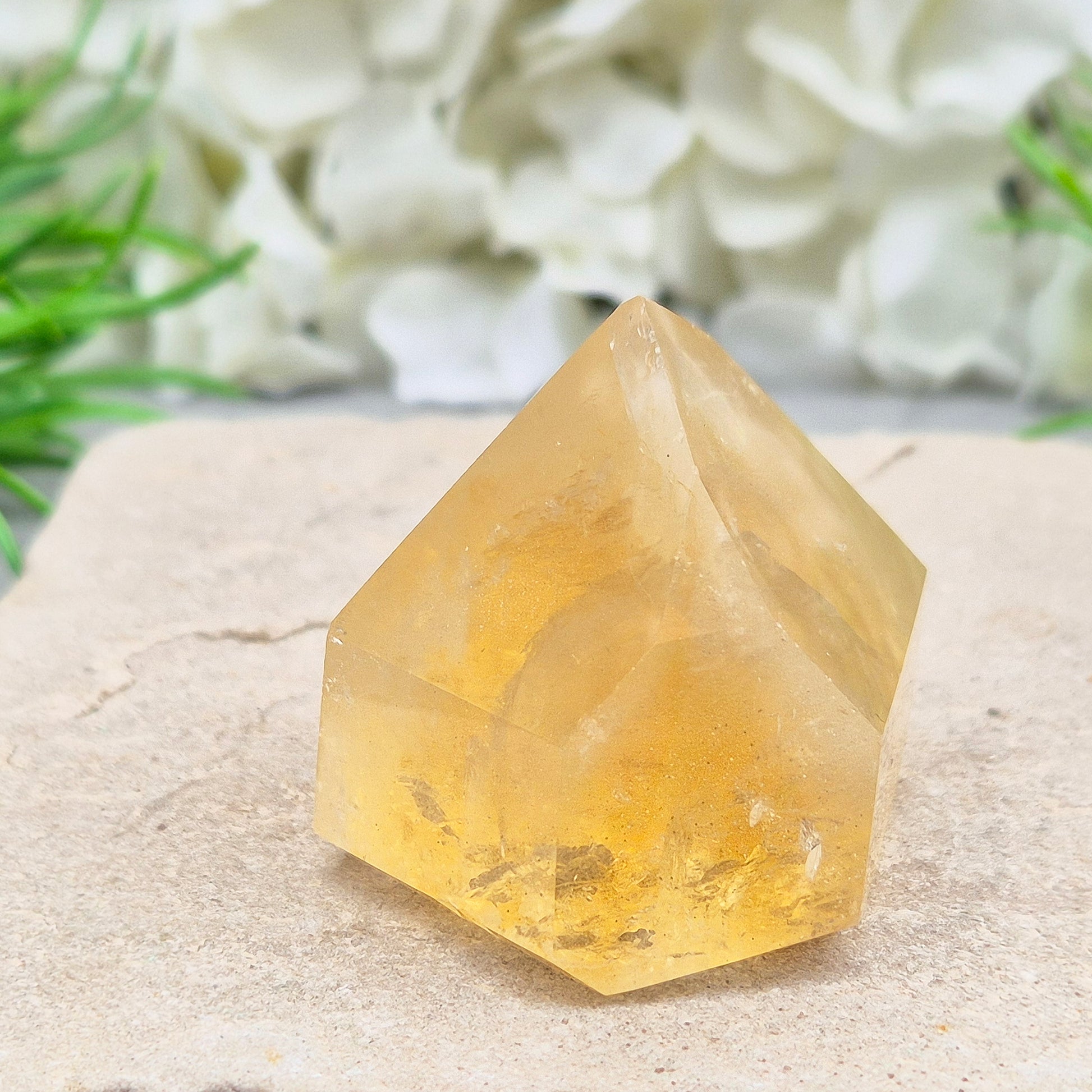 Natural Untreated polished Citrine Point sourced and polished in Brazil. Wonderful birght gold citrine colour with light reflecting inclusions and a raiunbow on the front face. 